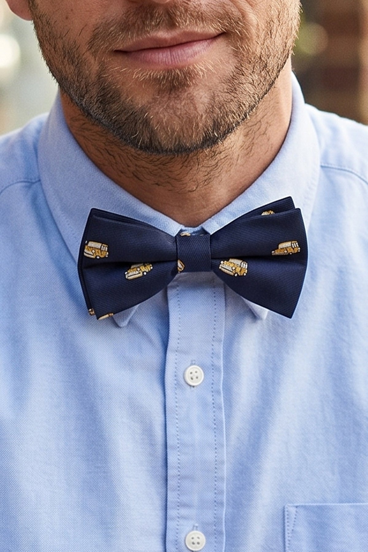 Man wearing Navy Mini Bow Tie for men featuring a rich navy colour with subtle embroidered detailing, crafted for those who appreciate classic elegance and timeless formal style.