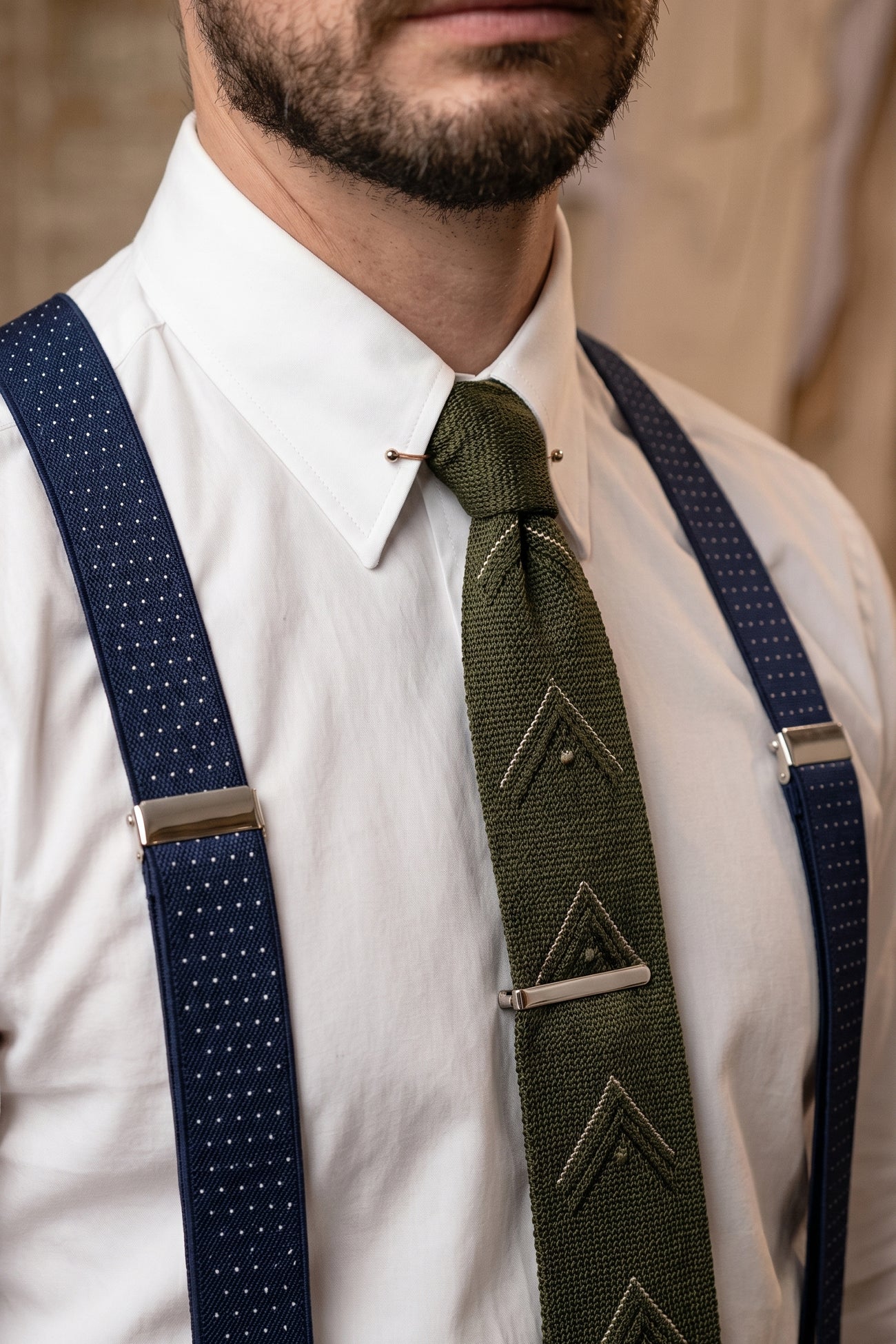 Men’s navy polka dot combination braces suspenders with leather ends and secure metal clips, suited for weddings, business or smart-casual outfits.