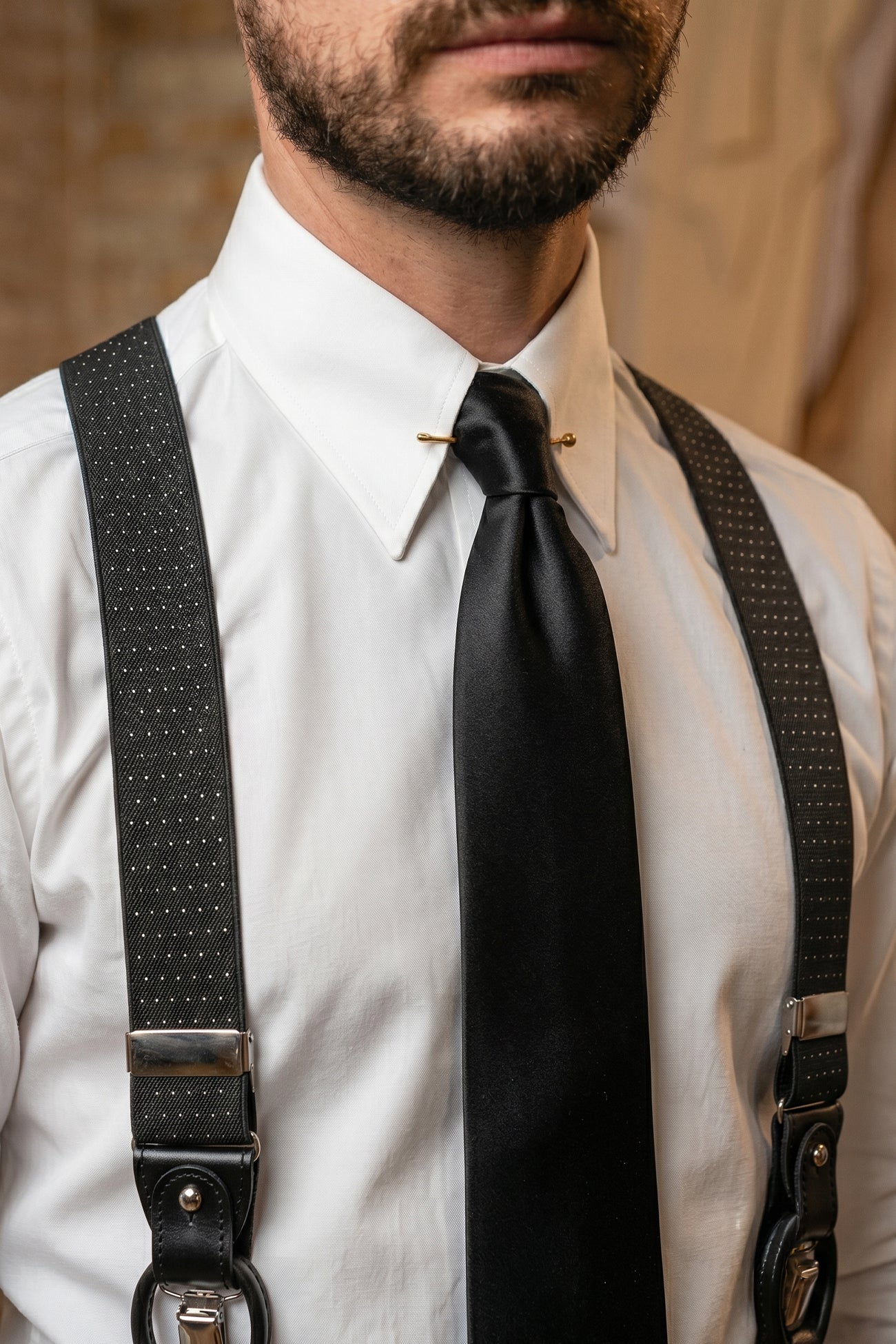 Men’s black polka dot combination suspenders with leather accents and adjustable clips, perfect for weddings, business, and elegant casual wear.