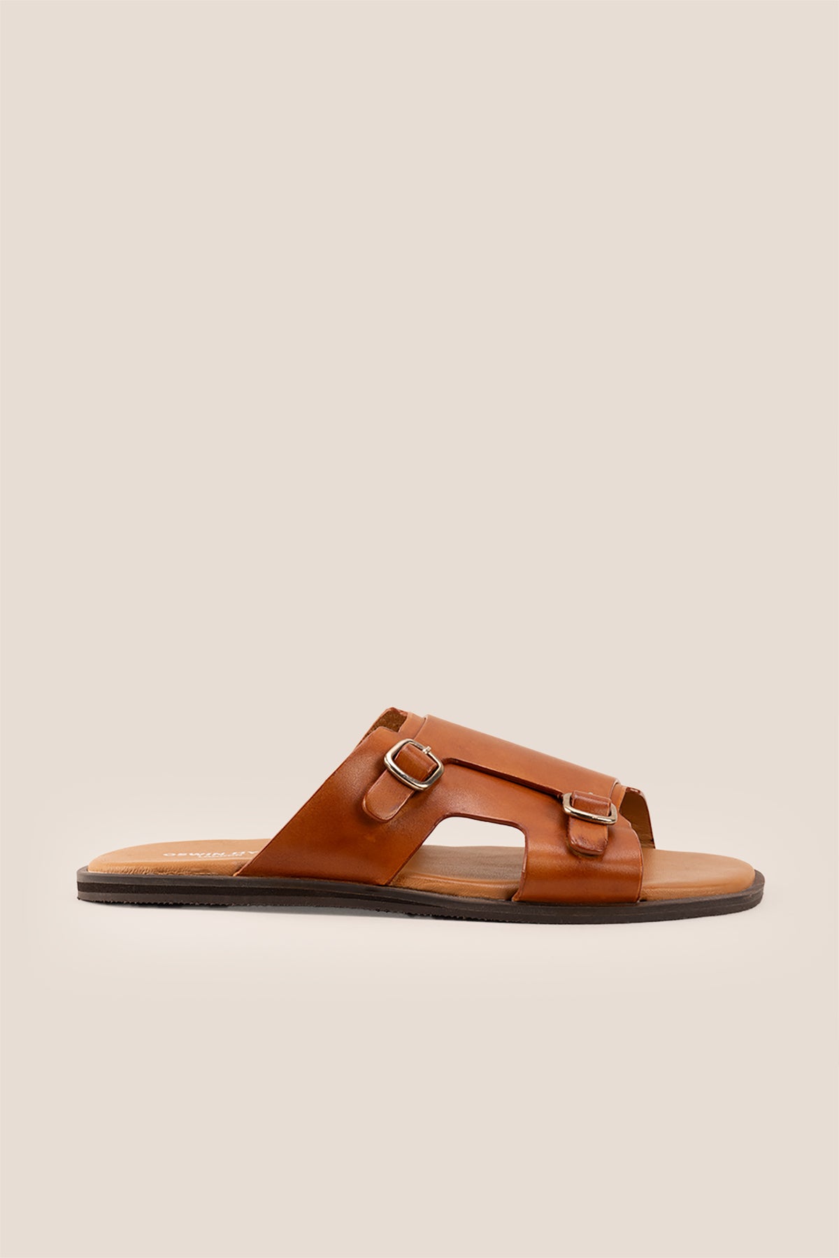 Logan tan leather sandals for men made from premium leather with open-toe design and stitched sole, ideal for summer comfort and smart-casual wear.