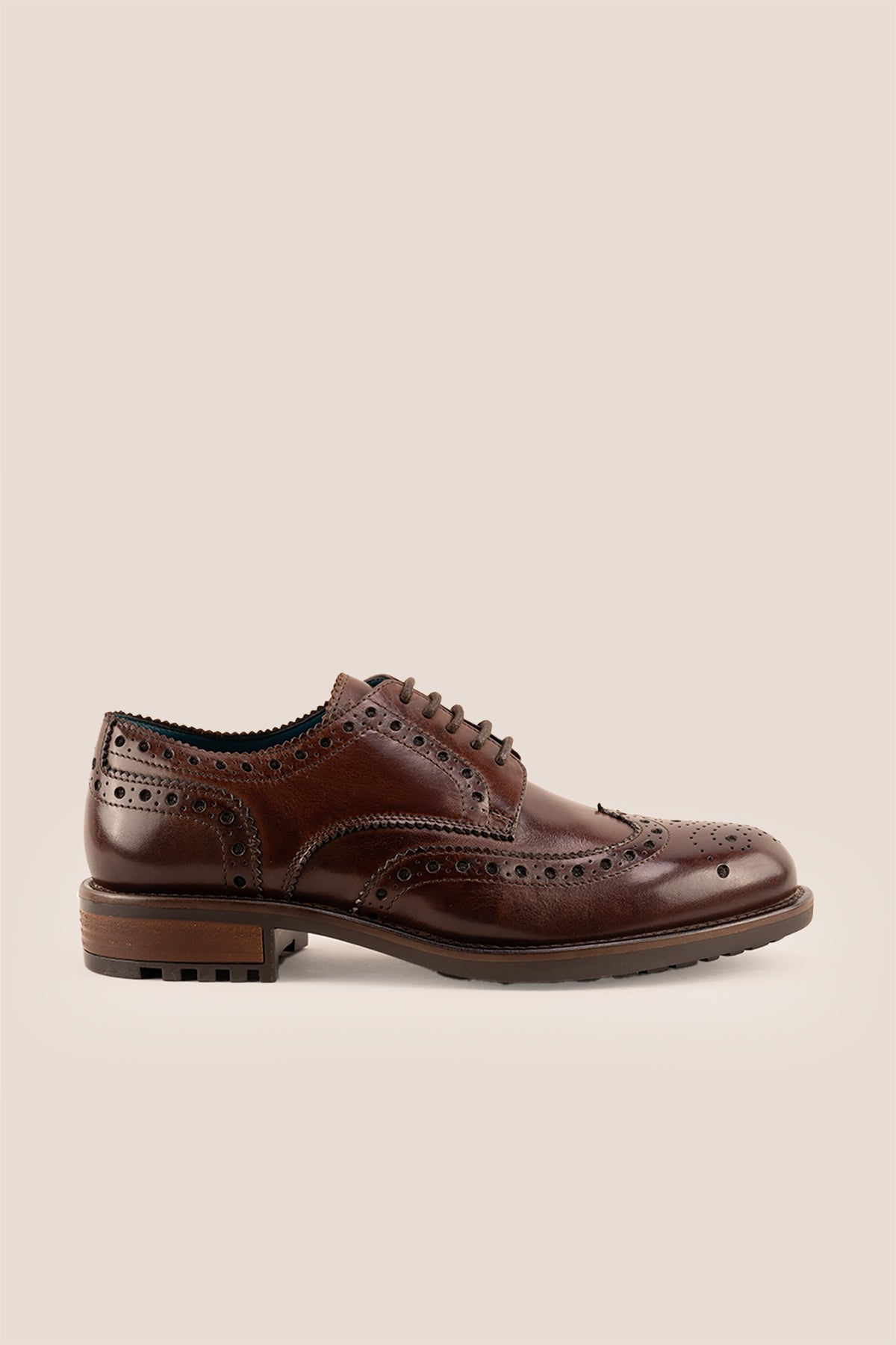 George Brown leather shoes for men. Featuring a five-eyelet wing cap brogue design, these shoes offer timeless style and comfort