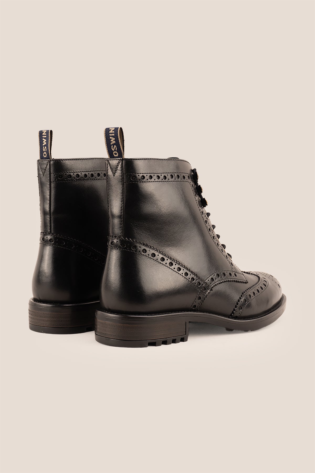 Gregory black leather lace-up boots for men featuring a classic wing cap brogue design with refined stitching and polished finish