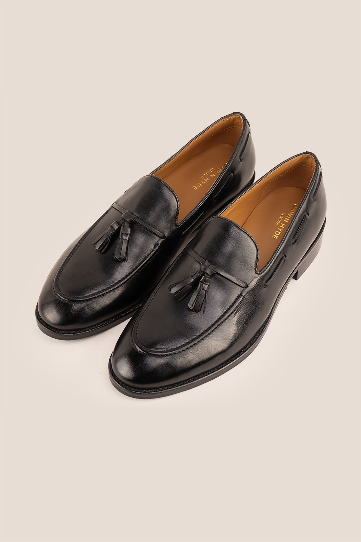 Issac Black Leather Tassel Loafers for men with cushioned sole, premium finish, and timeless style—ideal for formal wear and smart-casual outfits.