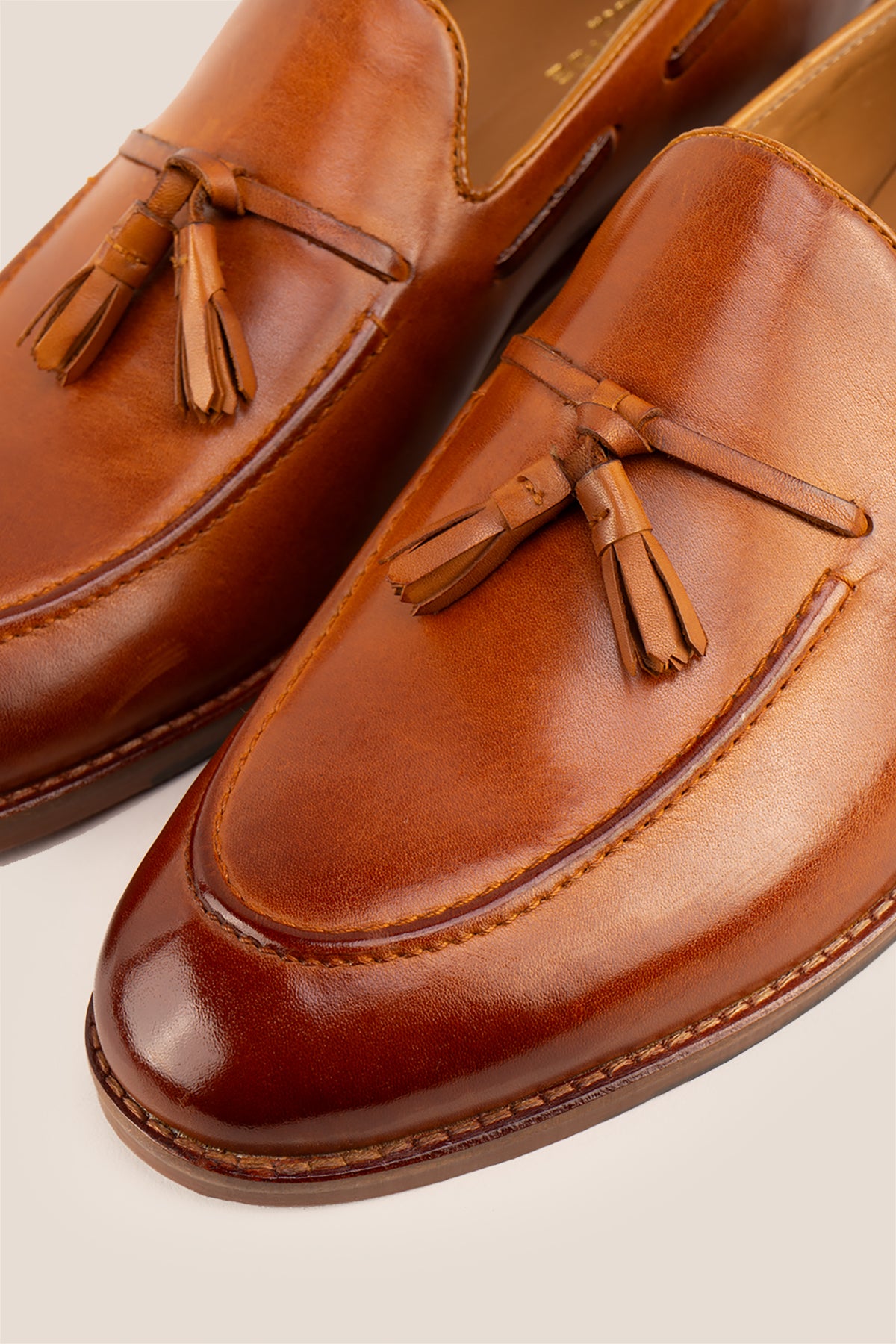 Issac Tan leather tassel loafers for men, featuring premium leather and comfort sole for all-day wear, ideal for smart-casual and formal occasions.
