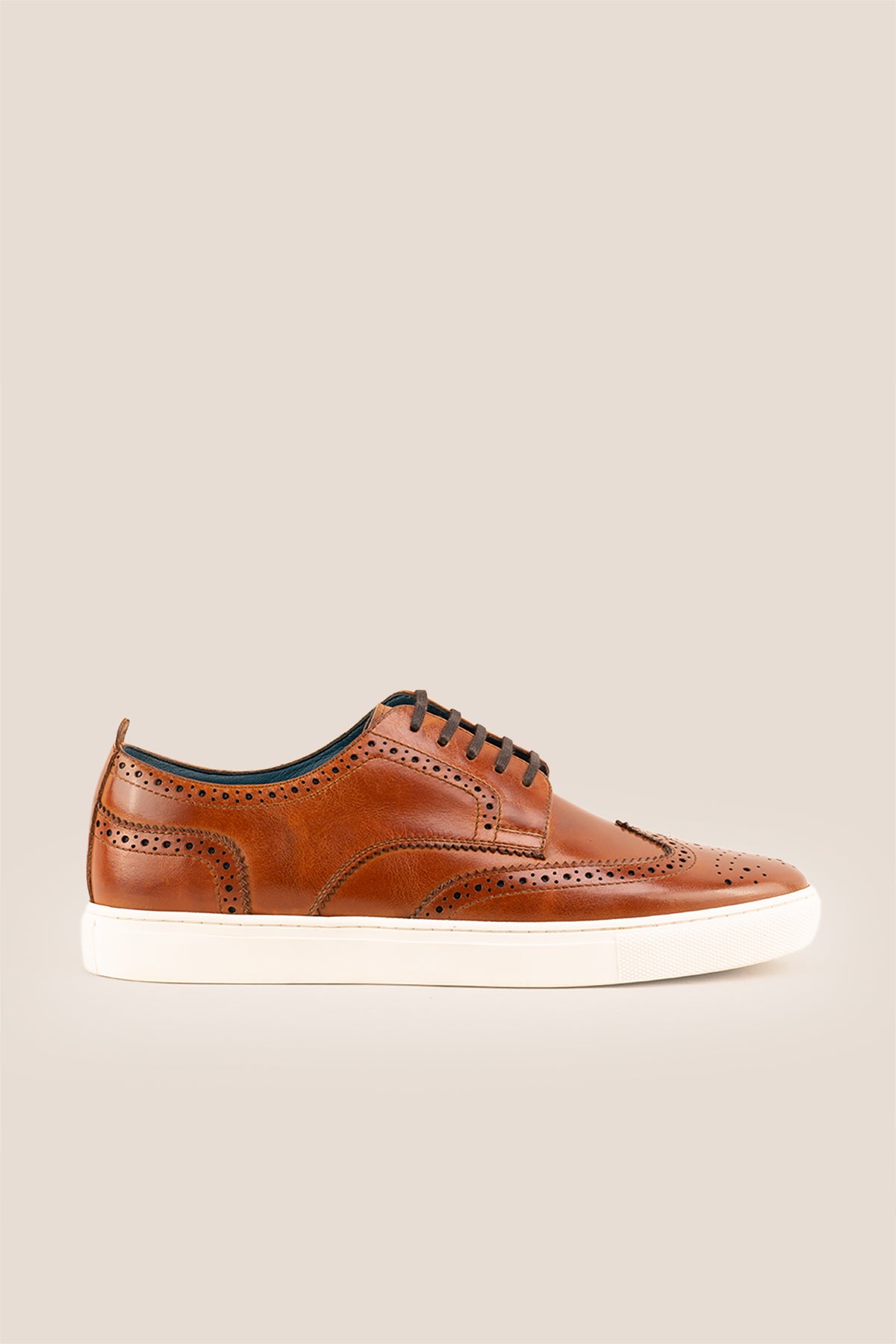 Men’s Stan cognac leather wingtip brogues featuring traditional perforated detailing, breathable lining and a durable leather sole.