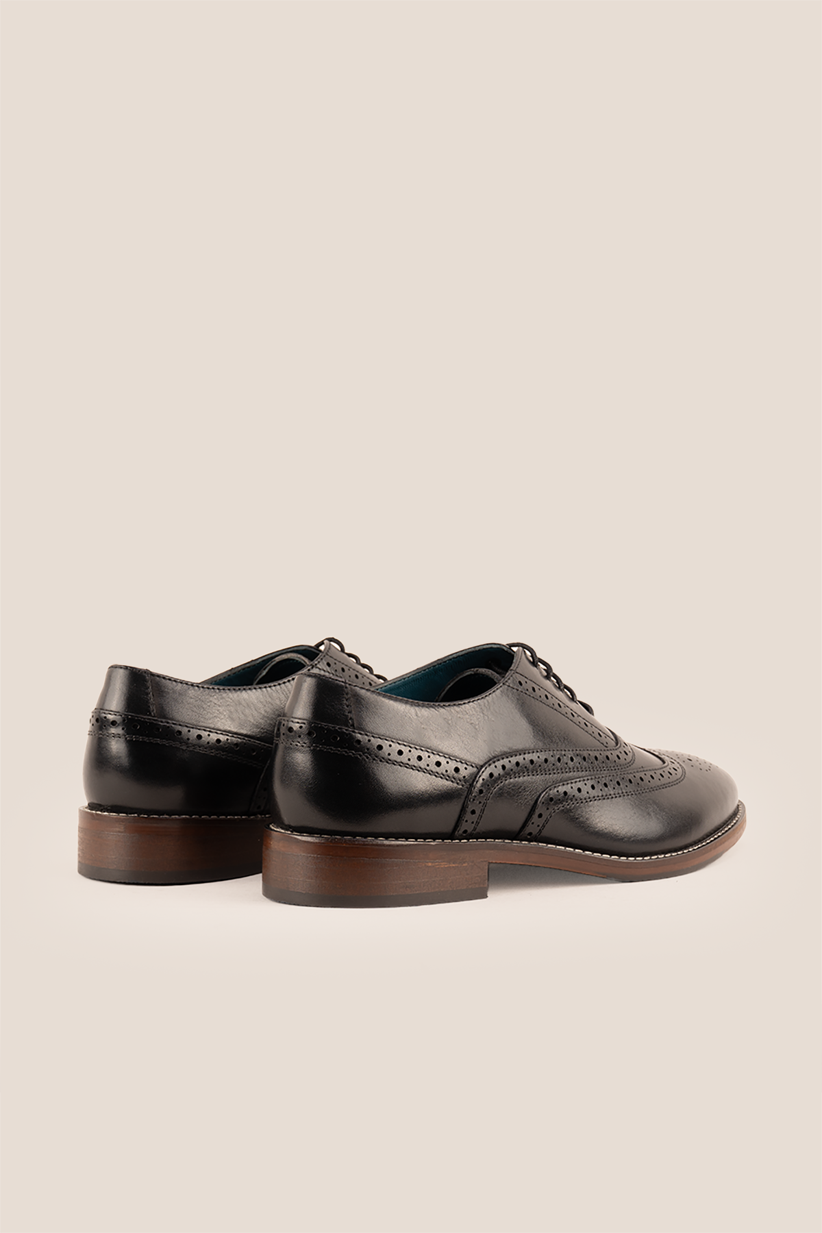 Winston wide fit black leather brogue shoes for men featuring classic punched detailing and premium finish.