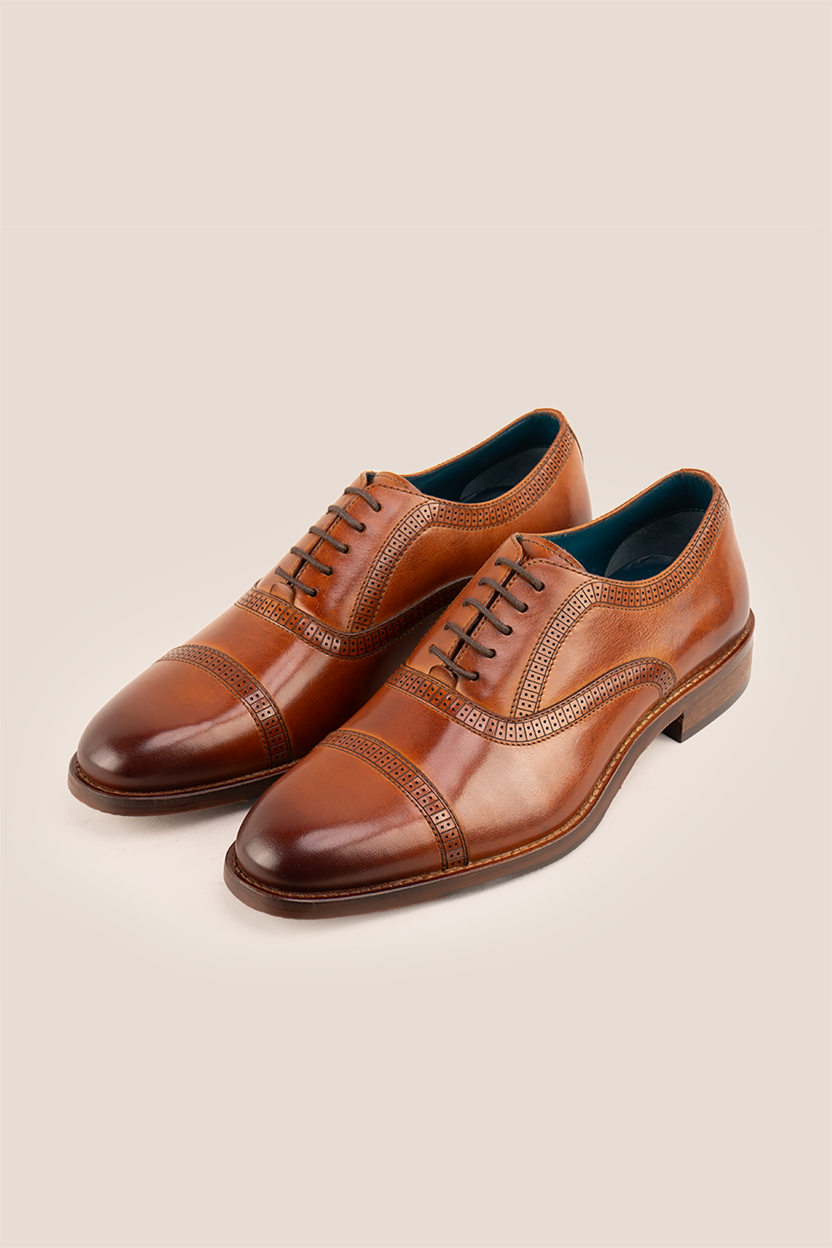 Creed tan men's leather shoes with timeless five-eyelet toecap brogue design, crafted in premium leather for a refined, sophisticated look