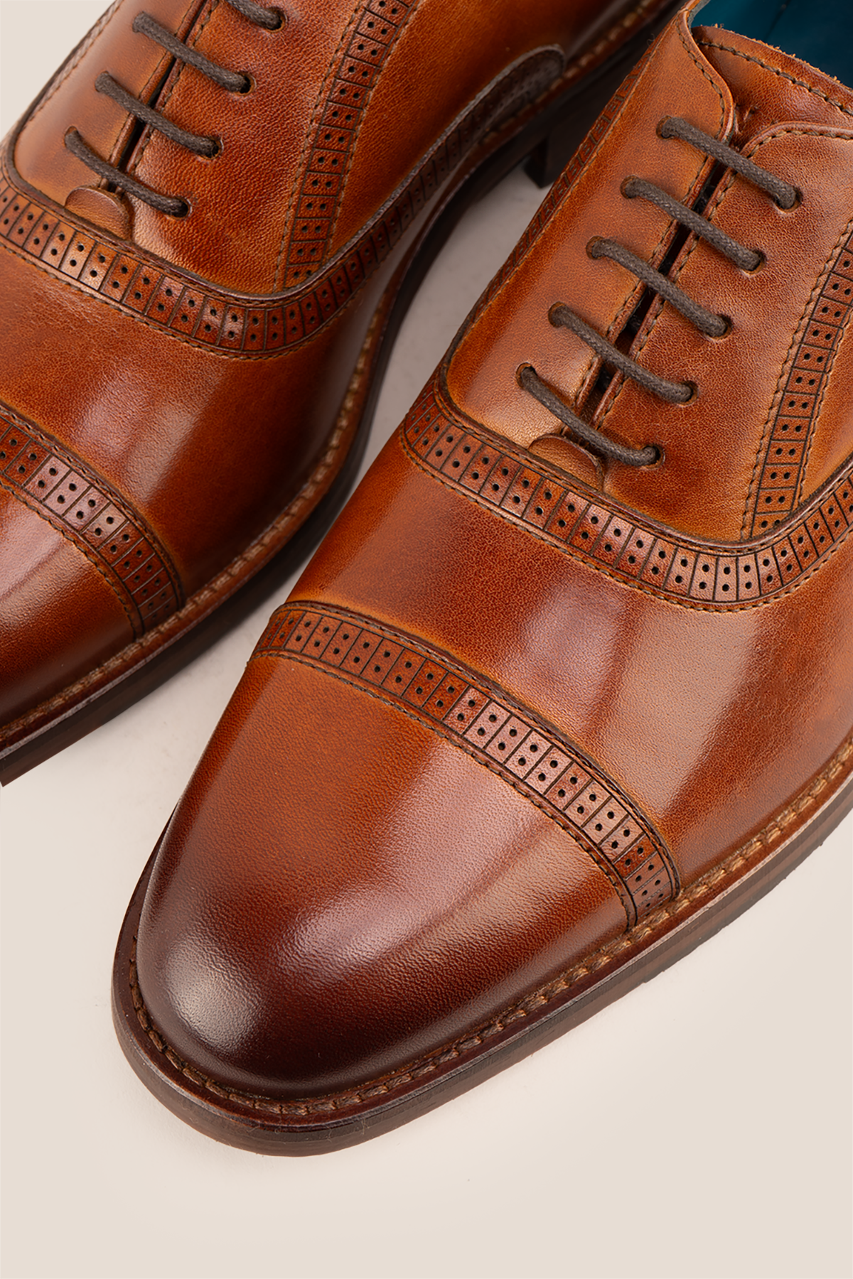 Creed tan men's leather shoes with timeless five-eyelet toecap brogue design, crafted in premium leather for a refined, sophisticated look