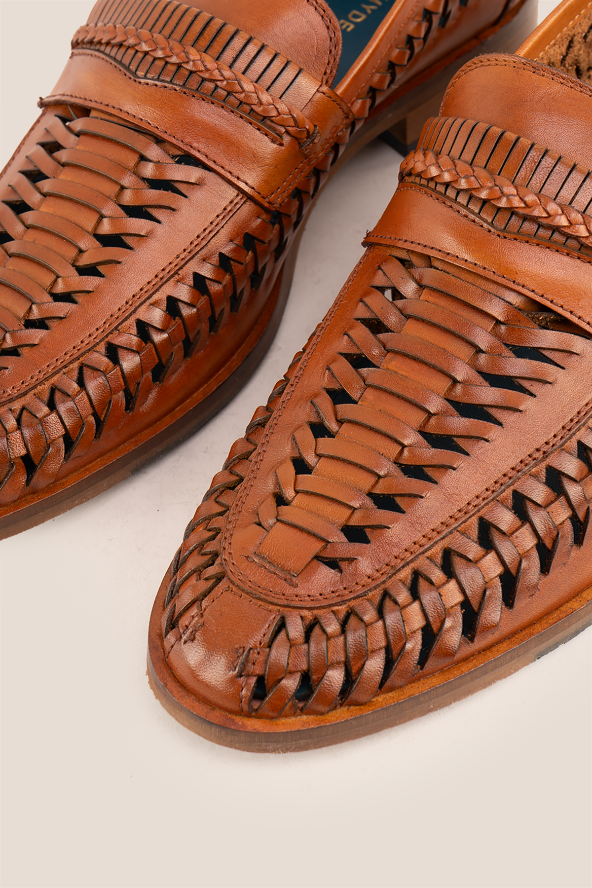 Finley tan woven leather loafer for men, showcasing premium craftsmanship with a sophisticated and timeless design
