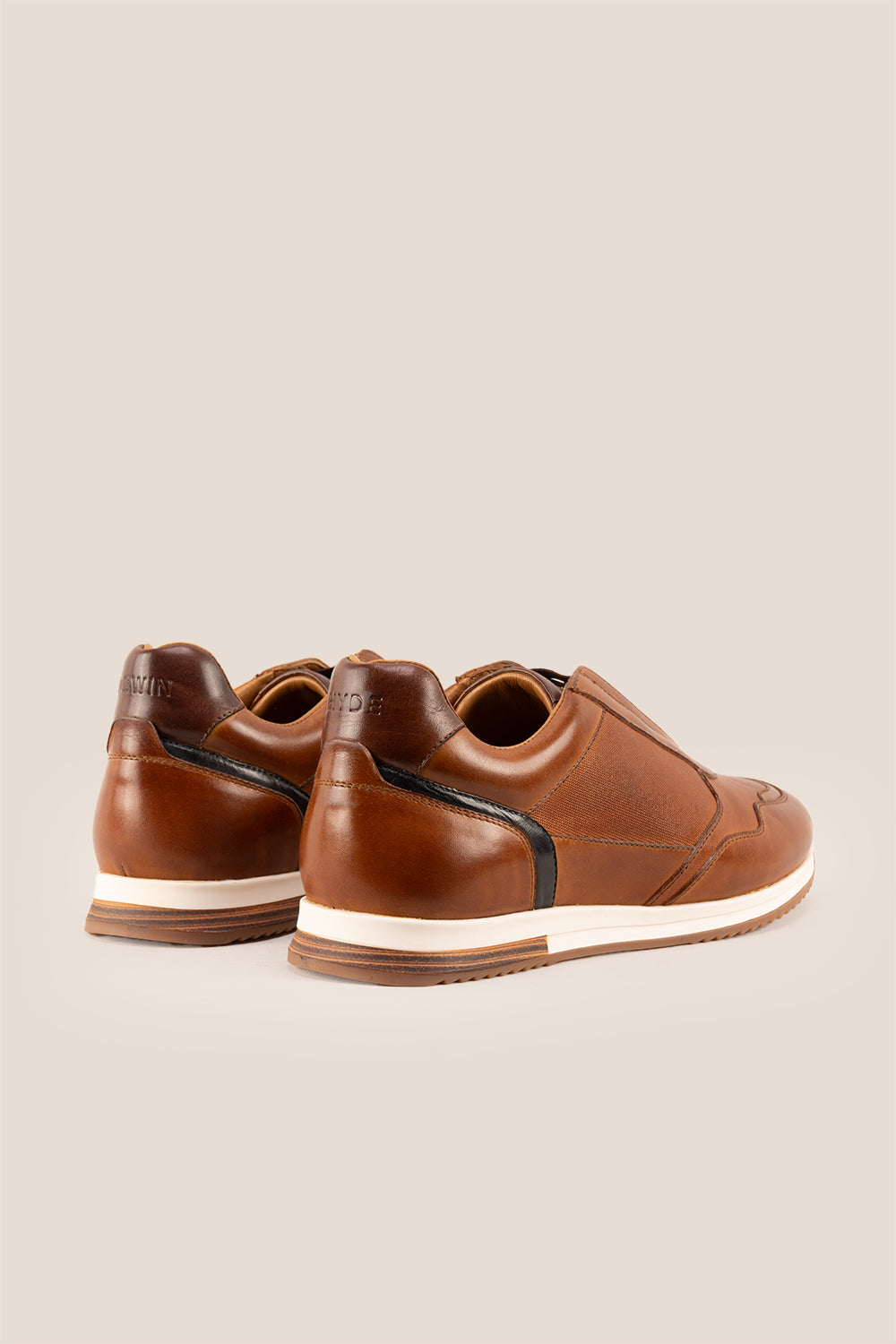 Colt tan men’s leather sneakers with elastic detailing for a secure, comfortable fit and modern casual style