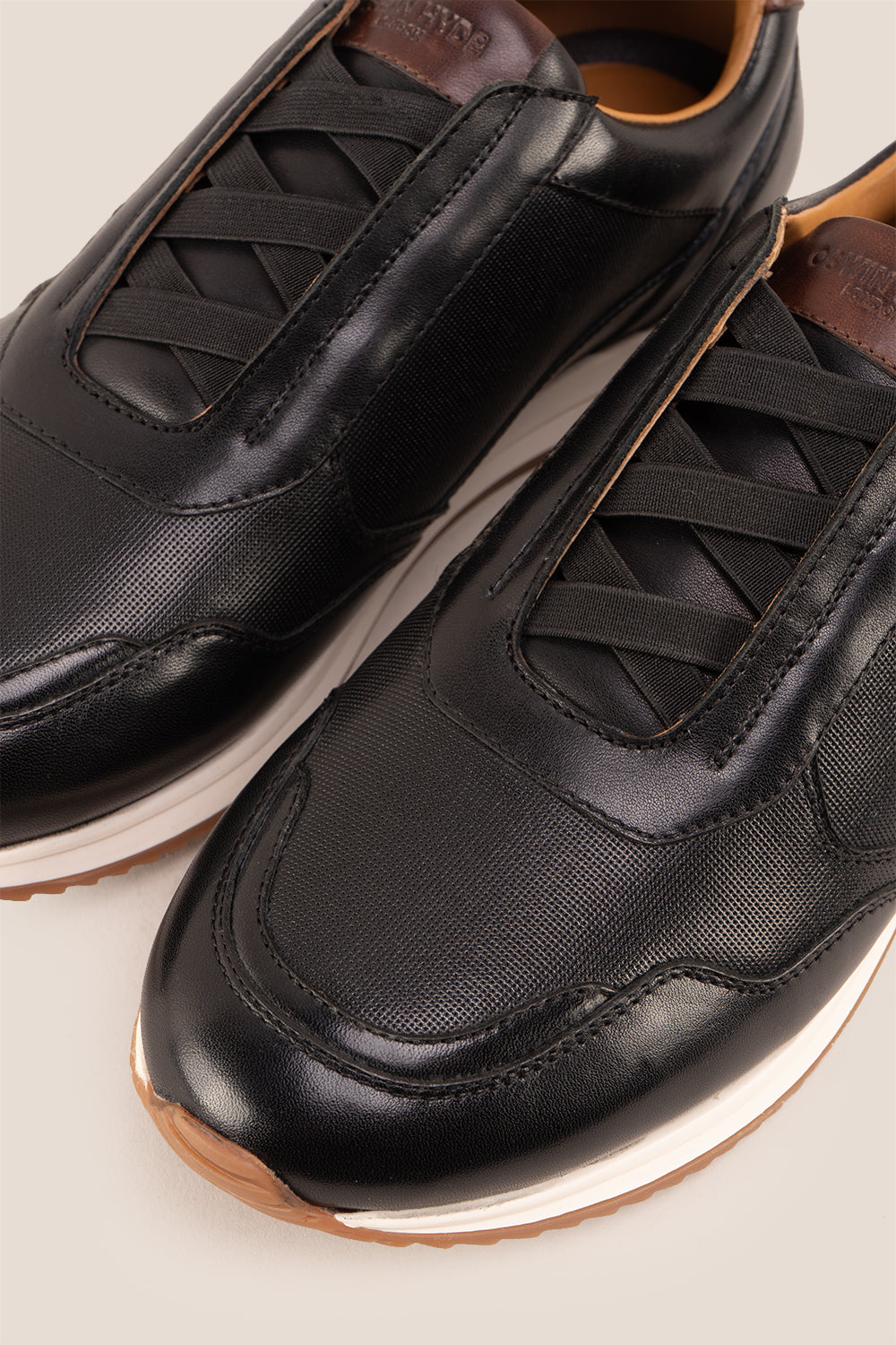 Colt black men's leather sneakers with elastic detailing for a secure, comfortable fit and sleek, modern style