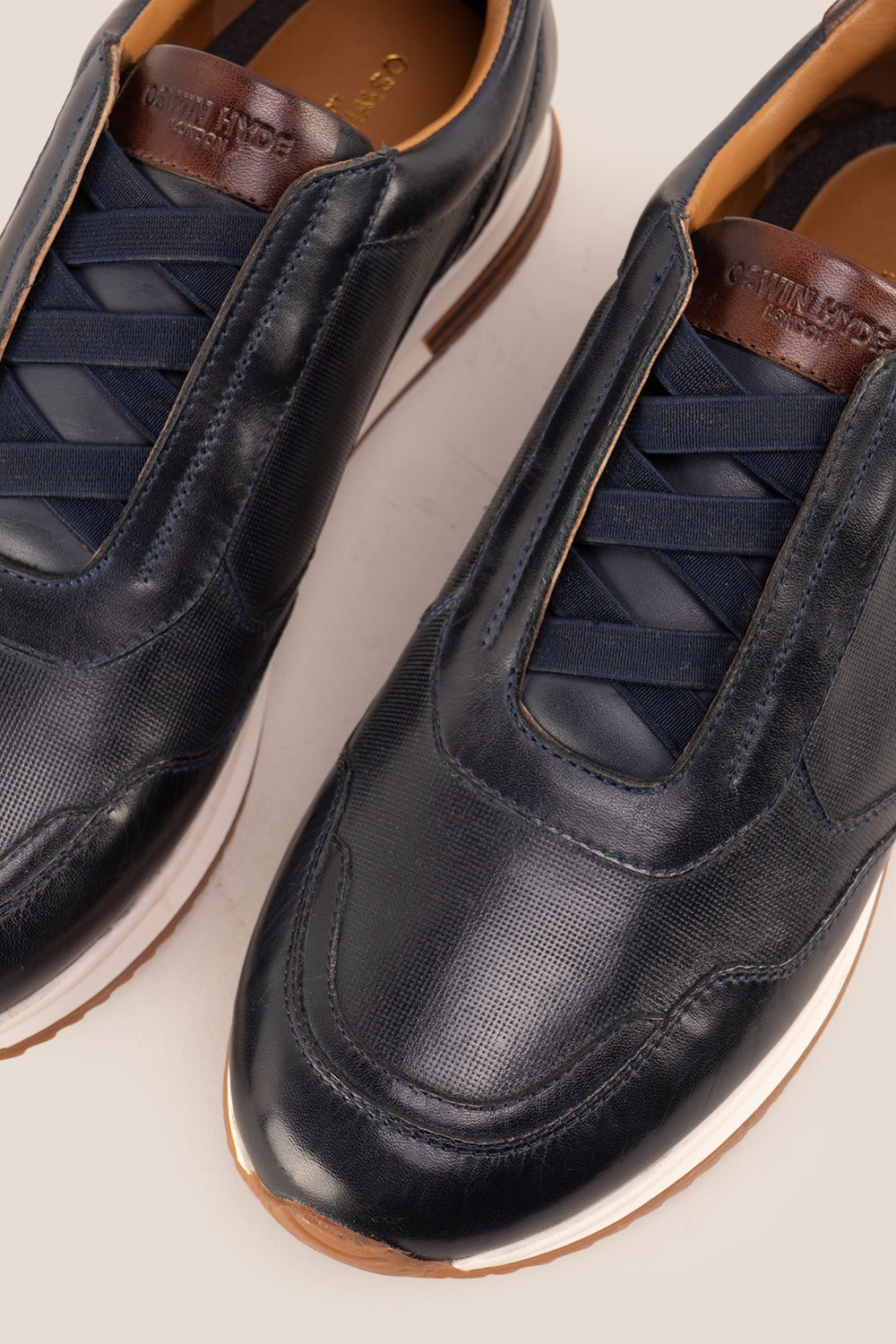 Colt Navy men's leather sneakers, featuring a clever elastic design that ensures a comfortable and secure fit. 
