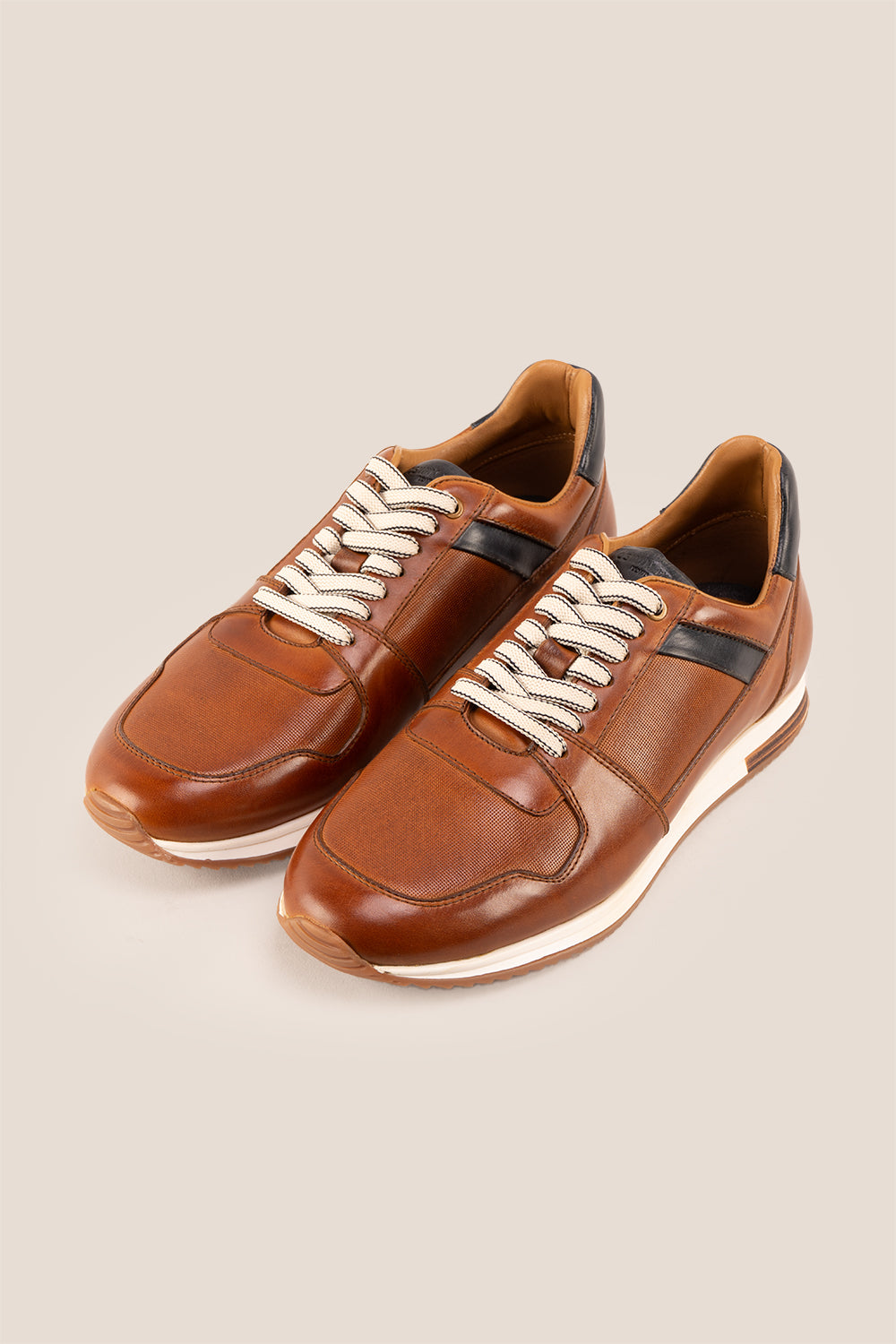 Rory Tan leather sneakers for men, featuring a classic design that exudes timeless elegance. 