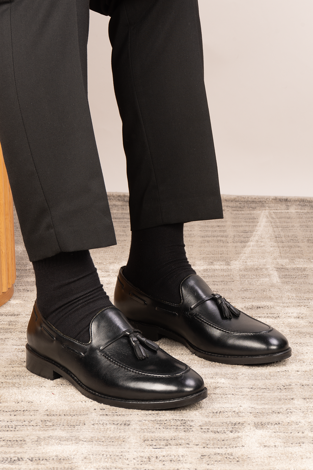 Issac Black Leather Tassel Loafers for men with cushioned sole, premium finish, and timeless style—ideal for formal wear and smart-casual outfits.