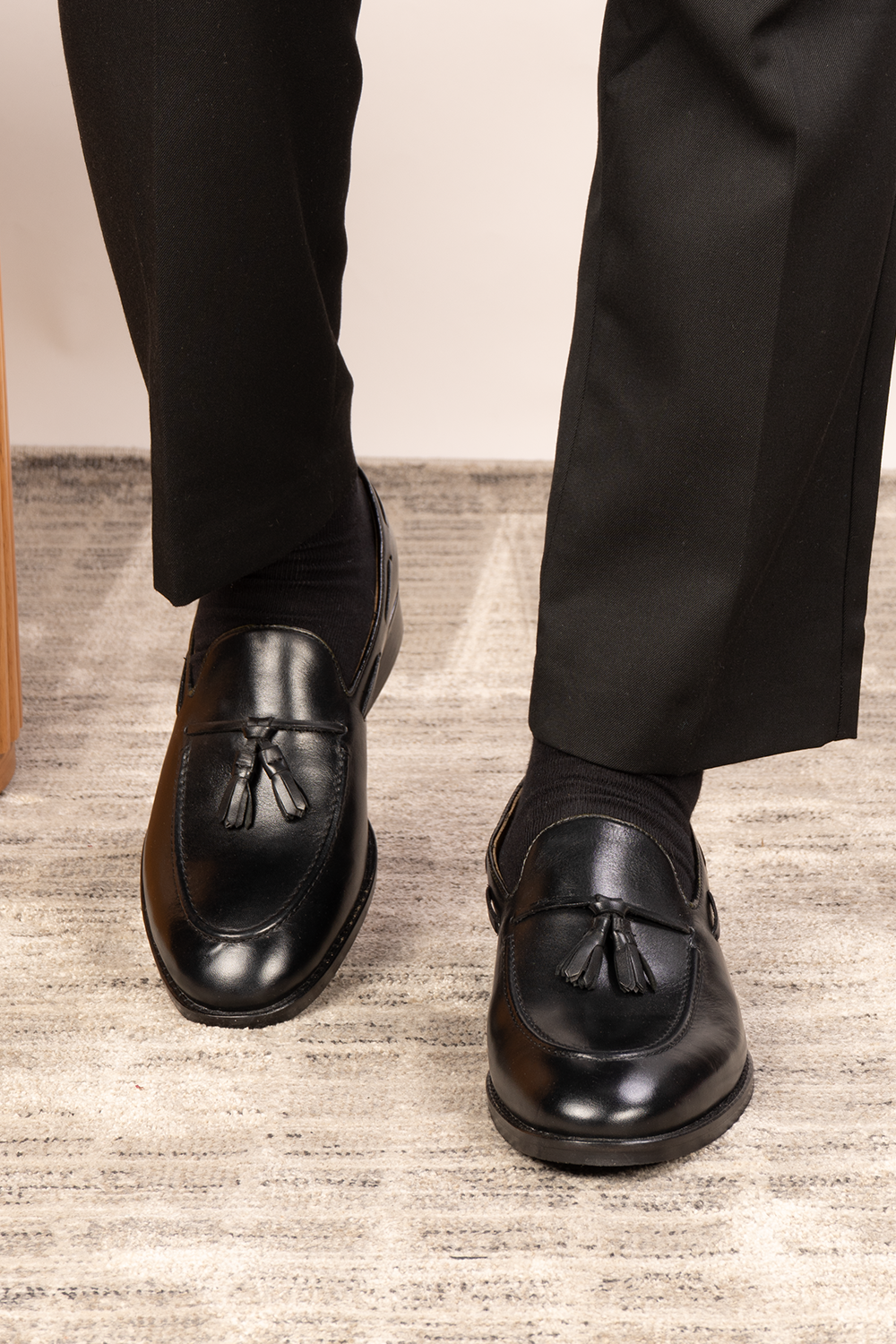 Issac Black Leather Tassel Loafers for men with cushioned sole, premium finish, and timeless style—ideal for formal wear and smart-casual outfits.