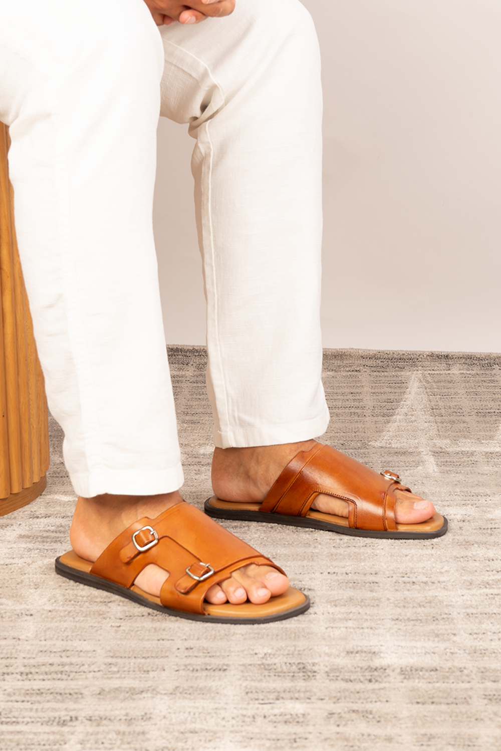 Logan tan leather sandals for men made from premium leather with open-toe design and stitched sole, ideal for summer comfort and smart-casual wear.