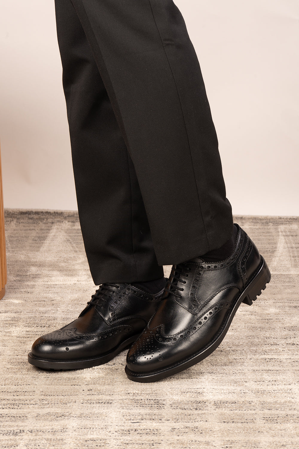 George black leather brogue shoes for men with five-eyelet wing cap design, combining classic craftsmanship and formal elegance.