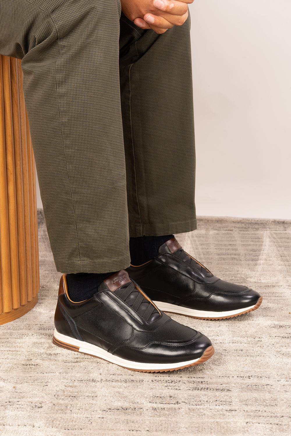 Colt black men's leather sneakers with elastic detailing for a secure, comfortable fit and sleek, modern style