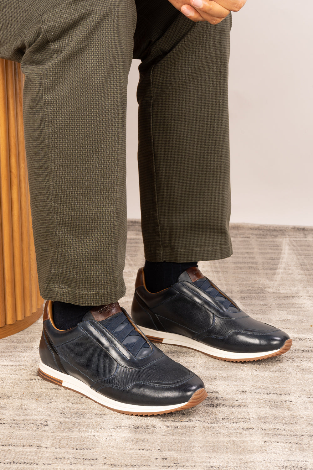 Colt Navy men's leather sneakers, featuring a clever elastic design that ensures a comfortable and secure fit. 