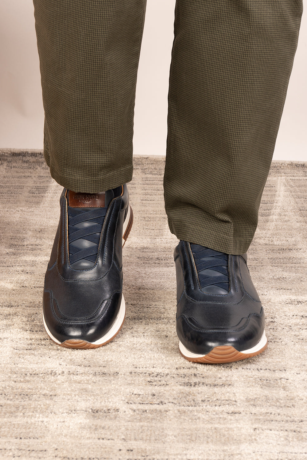 Colt Navy men's leather sneakers, featuring a clever elastic design that ensures a comfortable and secure fit. 