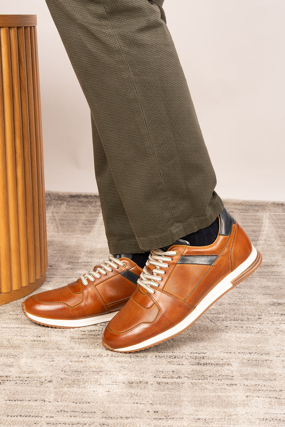 Rory Tan leather sneakers for men, featuring a classic design that exudes timeless elegance. 