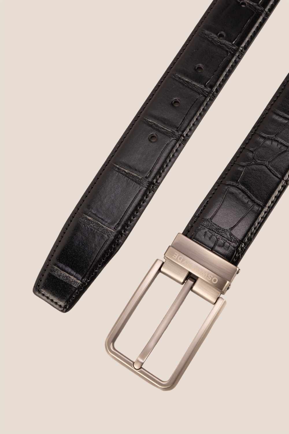 Reggie Black crocodile-embossed leather men’s belt with a classic pin buckle, offering a sleek and sophisticated finish to any outfit.