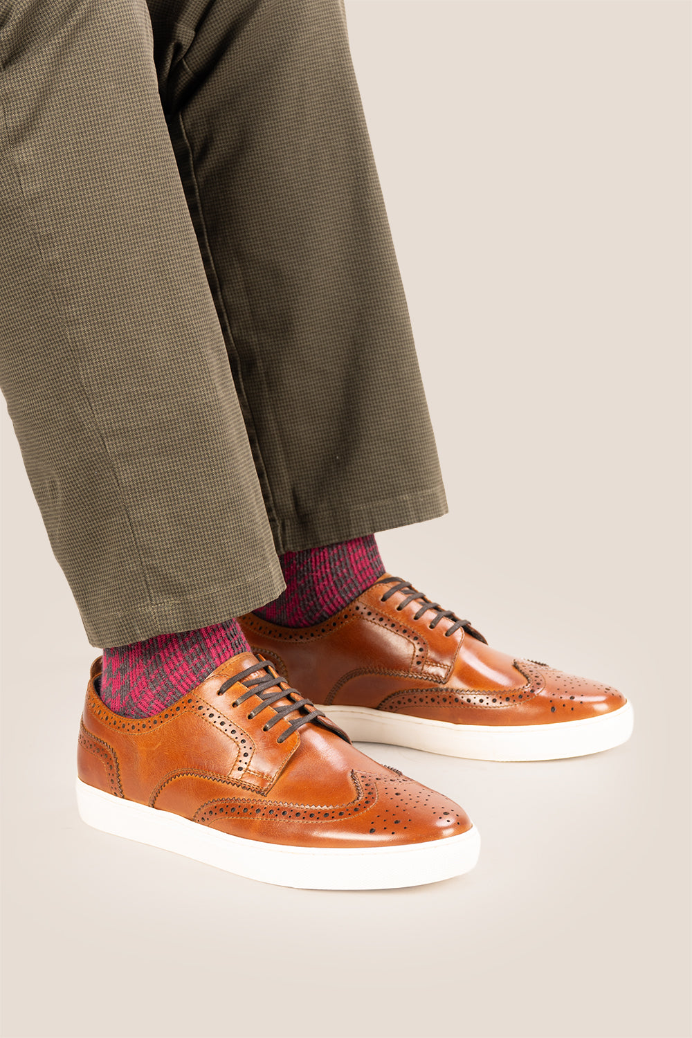 Men’s Stan cognac leather wingtip brogues featuring traditional perforated detailing, breathable lining and a durable leather sole.