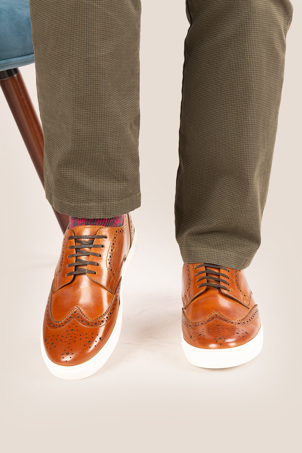 Men’s Stan cognac leather wingtip brogues featuring traditional perforated detailing, breathable lining and a durable leather sole.