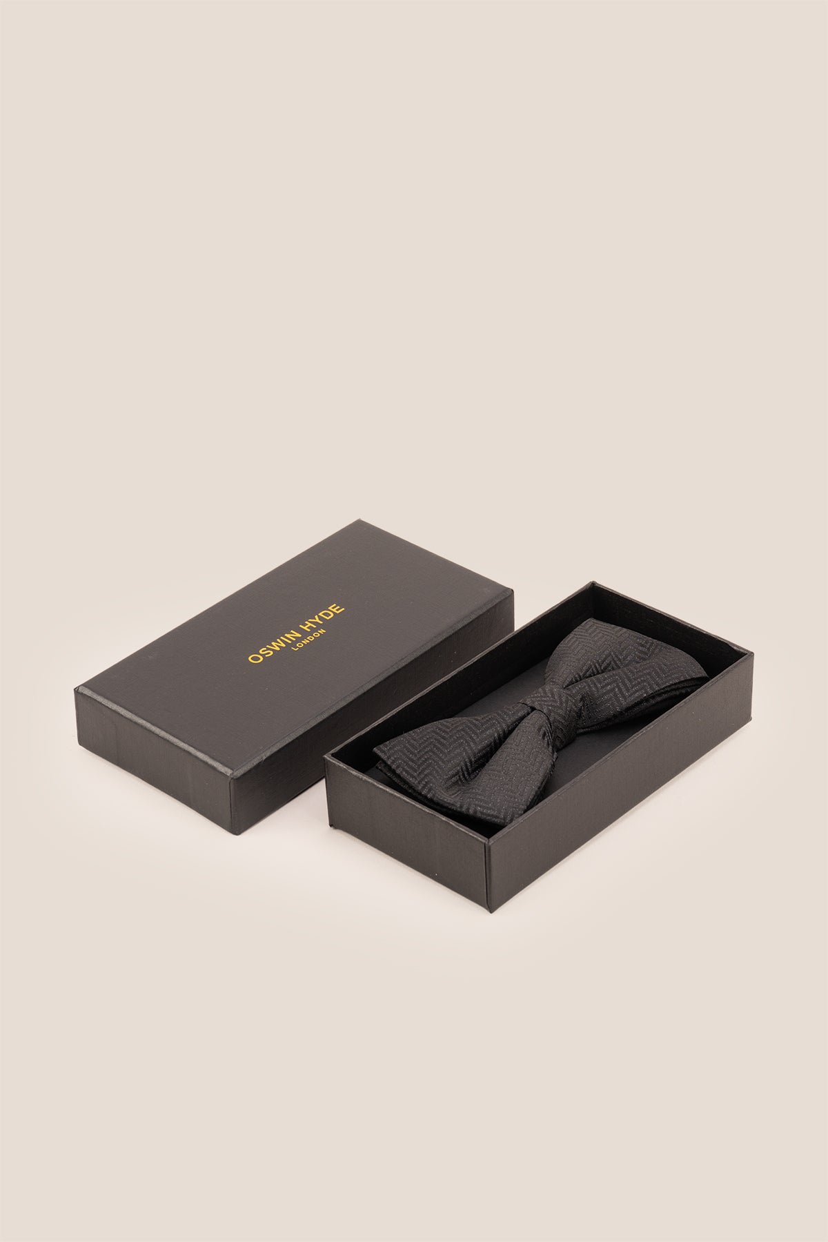 Oswin Hyde Herringbone Black Bowtie, featuring a classic herringbone pattern. deep black colour and textured fabric with an intricate design