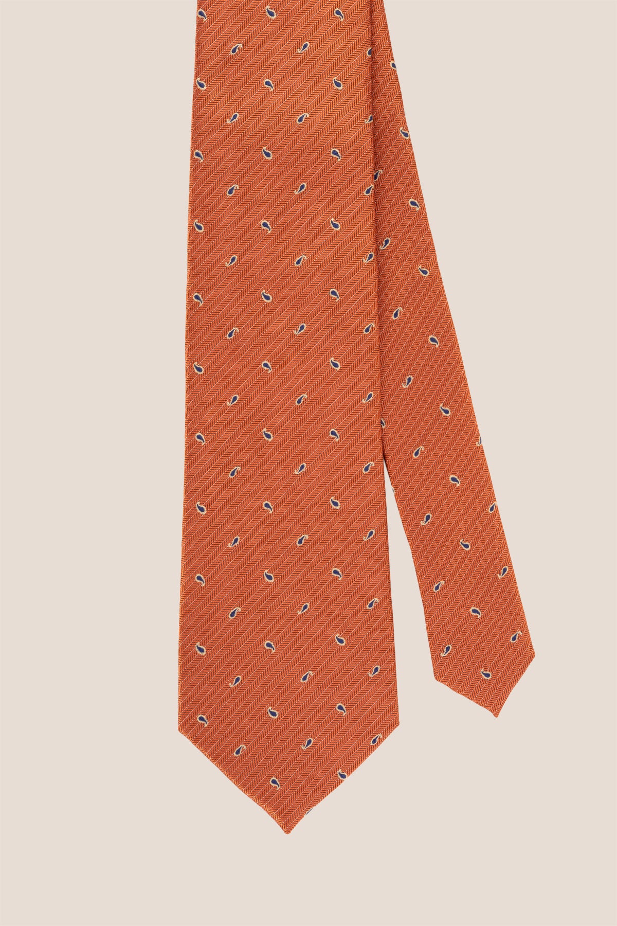 Oswin Hyde Copper Micro Paisley ties for men. The rich copper hue, combined with intricate paisley patterns,  crafted from high-quality material