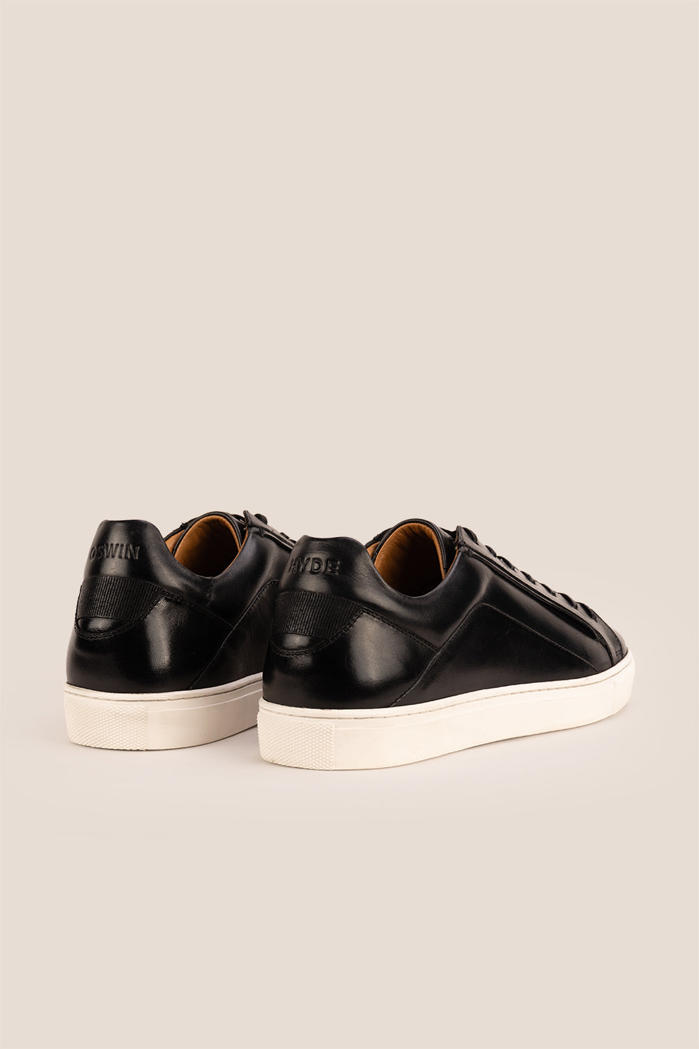 Hayes Black leather sneakers for men, featuring a classic seven-eyelet design that brings a touch of sophistication to your casual wardrobe. Made from premium leather
