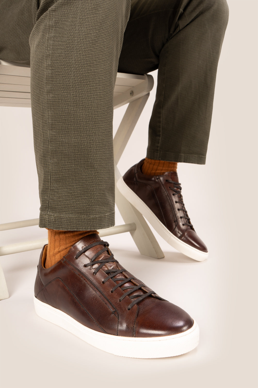 Hayes Brown leather sneakers for men, designed with a classic seven-eyelet style that enhances your everyday attire. Made from premium leather