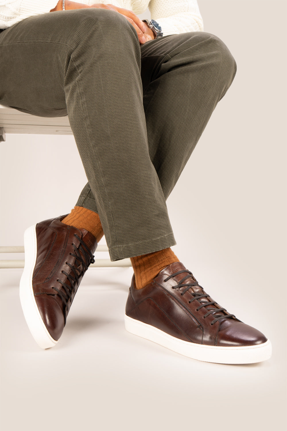 Hayes Brown leather sneakers for men, designed with a classic seven-eyelet style that enhances your everyday attire. Made from premium leather