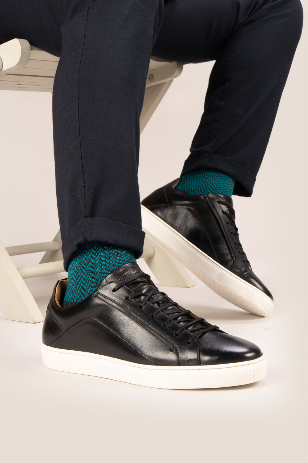 Hayes Black leather sneakers for men, featuring a classic seven-eyelet design that brings a touch of sophistication to your casual wardrobe. Made from premium leather