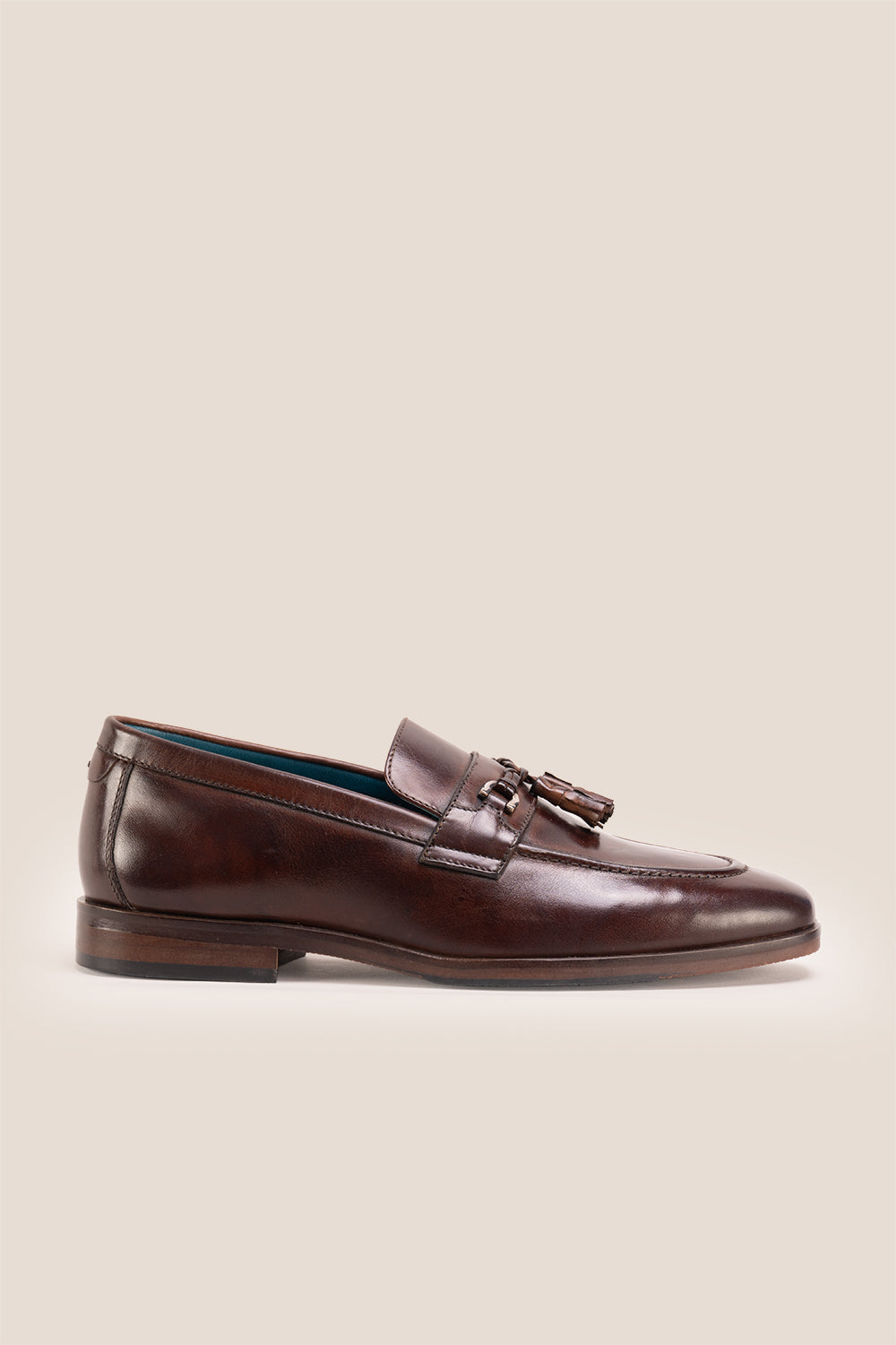 Emmet Brown loafers, crafted from luxurious leather and adorned with refined metal accents