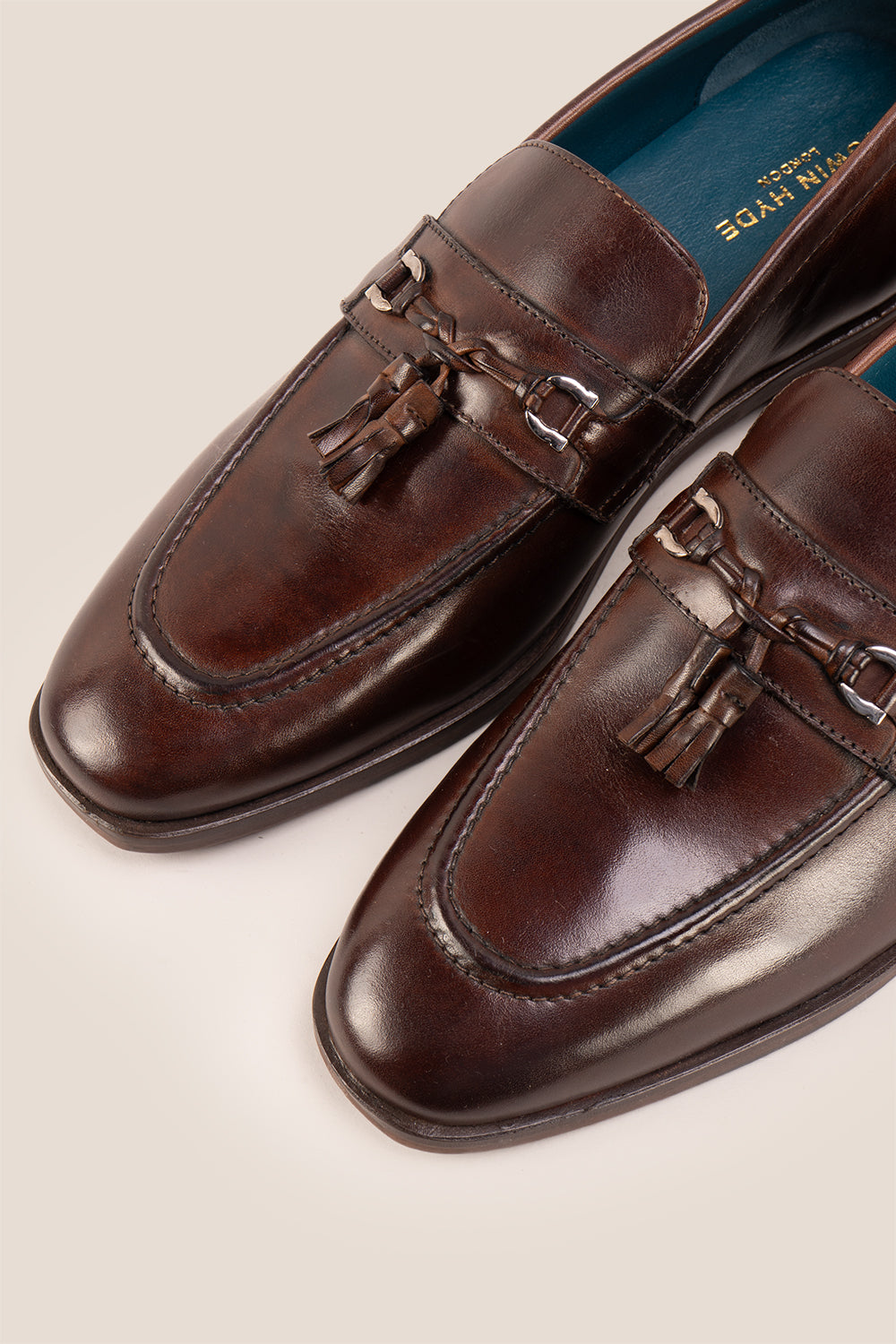 Emmet Brown loafers, crafted from luxurious leather and adorned with refined metal accents