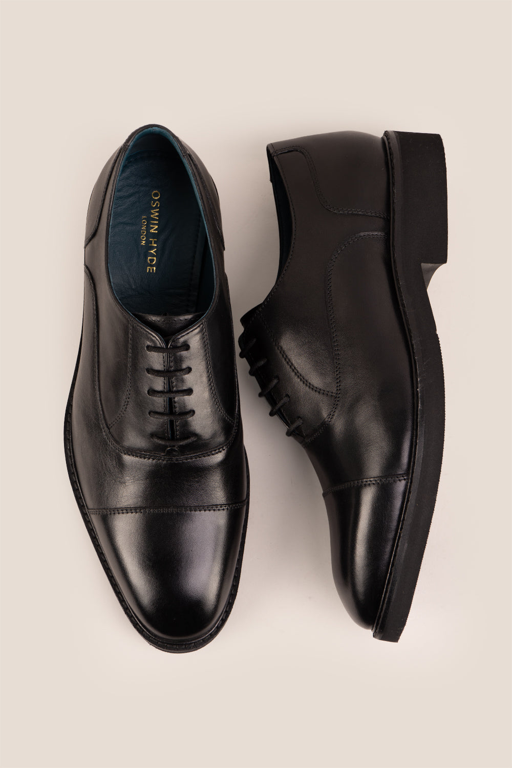 Flint Black Oxford lace-up men’s leather shoes with a sleek silhouette and polished finish, ideal for formal and professional wear.