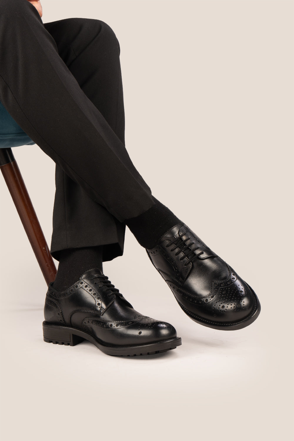 George Black leather shoes for men. Featuring a five-eyelet wing cap brogue design, these shoes offer timeless style and comfort