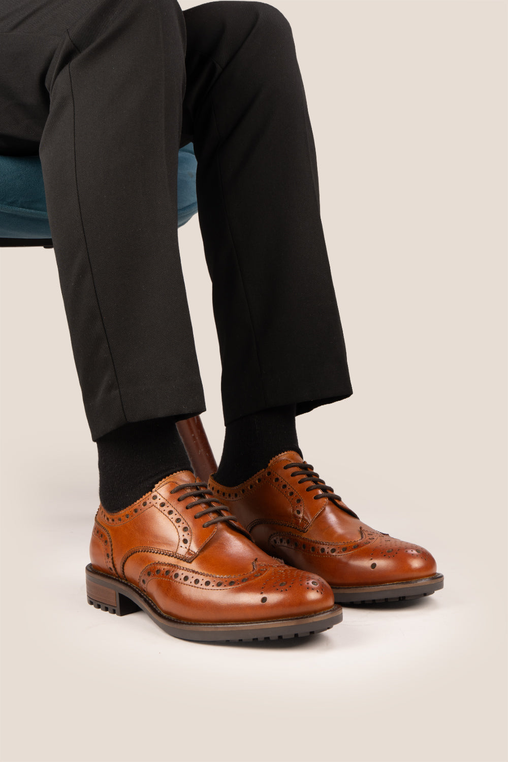 George Tan leather shoes for men. Featuring a five-eyelet wing cap brogue design, these shoes offer timeless style and comfort