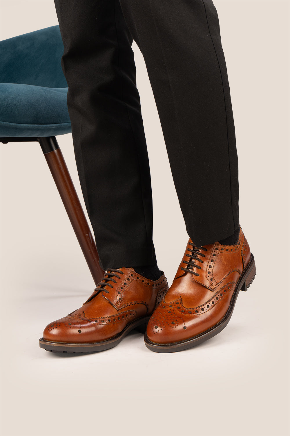 George Tan leather shoes for men. Featuring a five-eyelet wing cap brogue design, these shoes offer timeless style and comfort