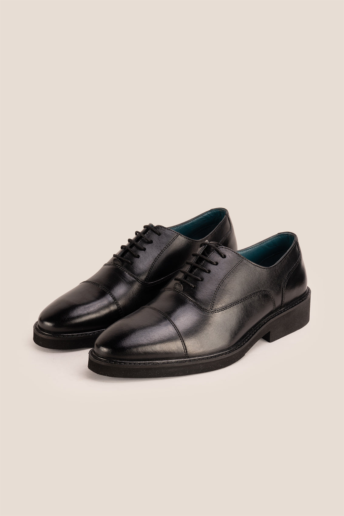 Flint Black Oxford lace-up men’s leather shoes with a sleek silhouette and polished finish, ideal for formal and professional wear.