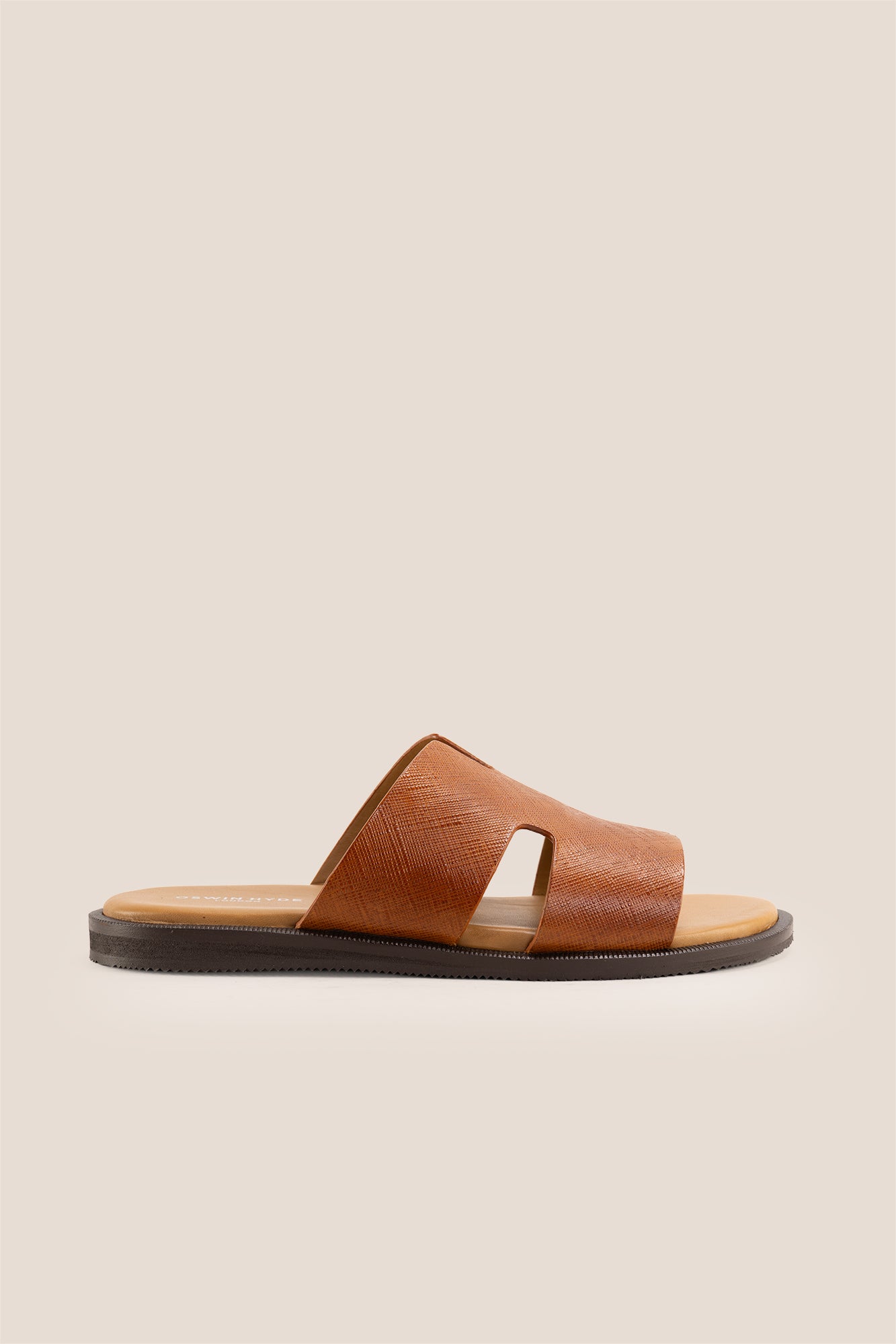 Men’s Phoenix Tan sandals in premium Saffiano leather featuring the signature hyde strap H-frame design.