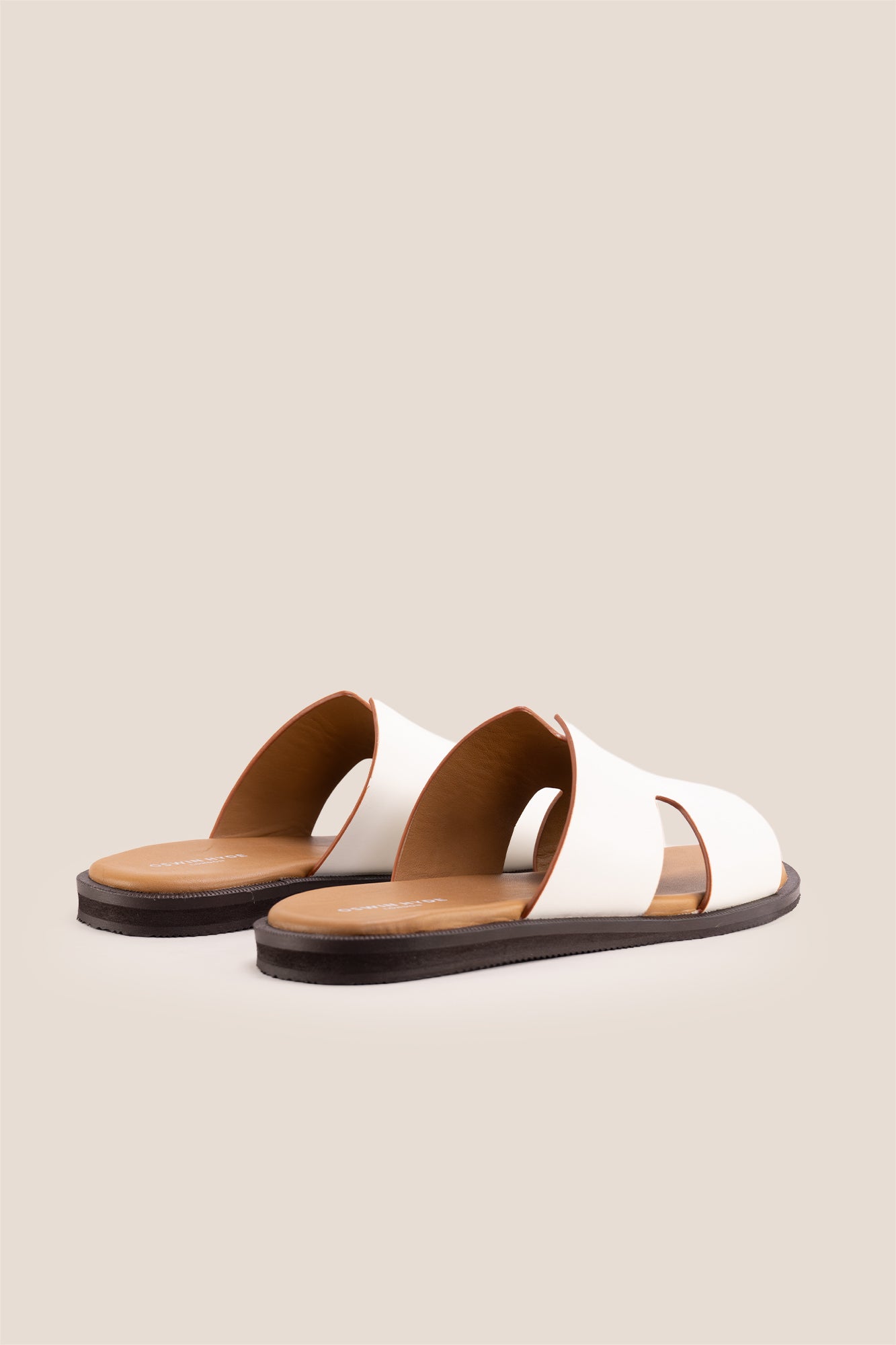 Men’s Phoenix White sandals in premium white leather featuring a minimalist hyde strap H-frame design.