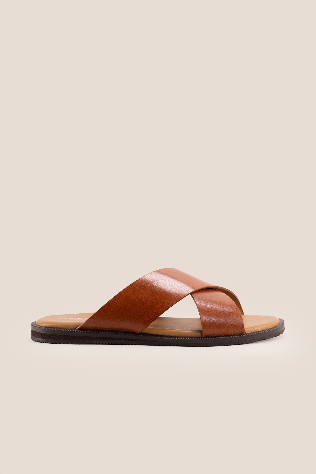 Men’s Ollie Tan sandals featuring a bold, wide criss-cross strap design in smooth high-grade tan leather.
