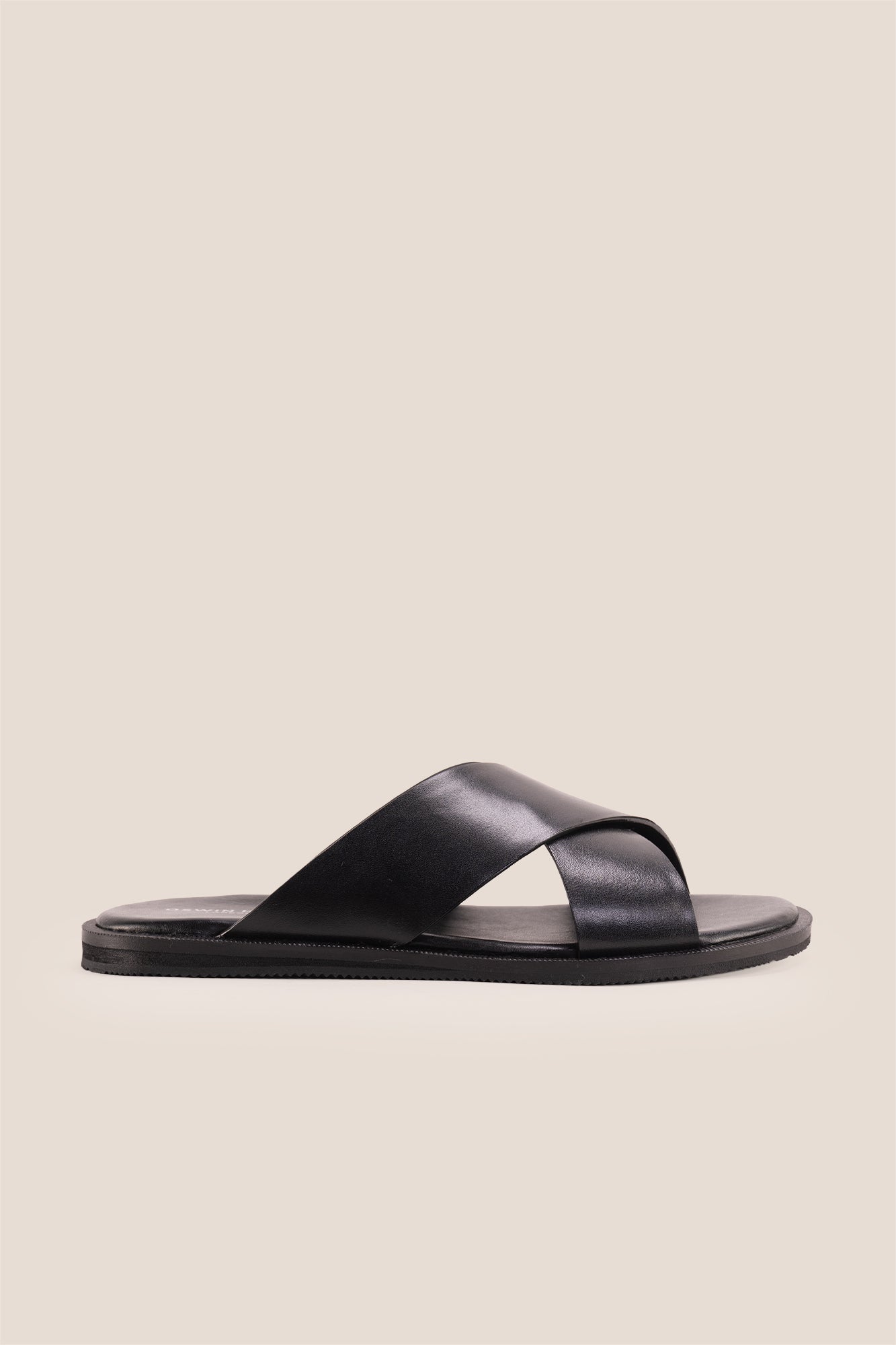 Men’s Ollie Black sandals featuring a bold, wide criss-cross strap design in smooth high-grade tan leather.