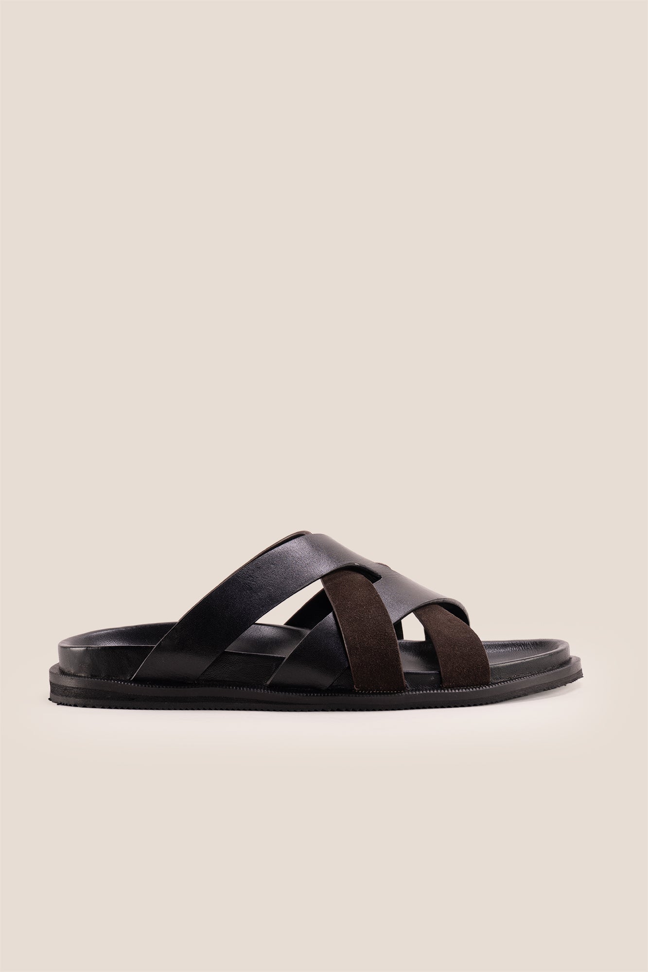 Men’s Rowan Brown slide sandals featuring a textured brown suede X-strap design and a cushioned sole.