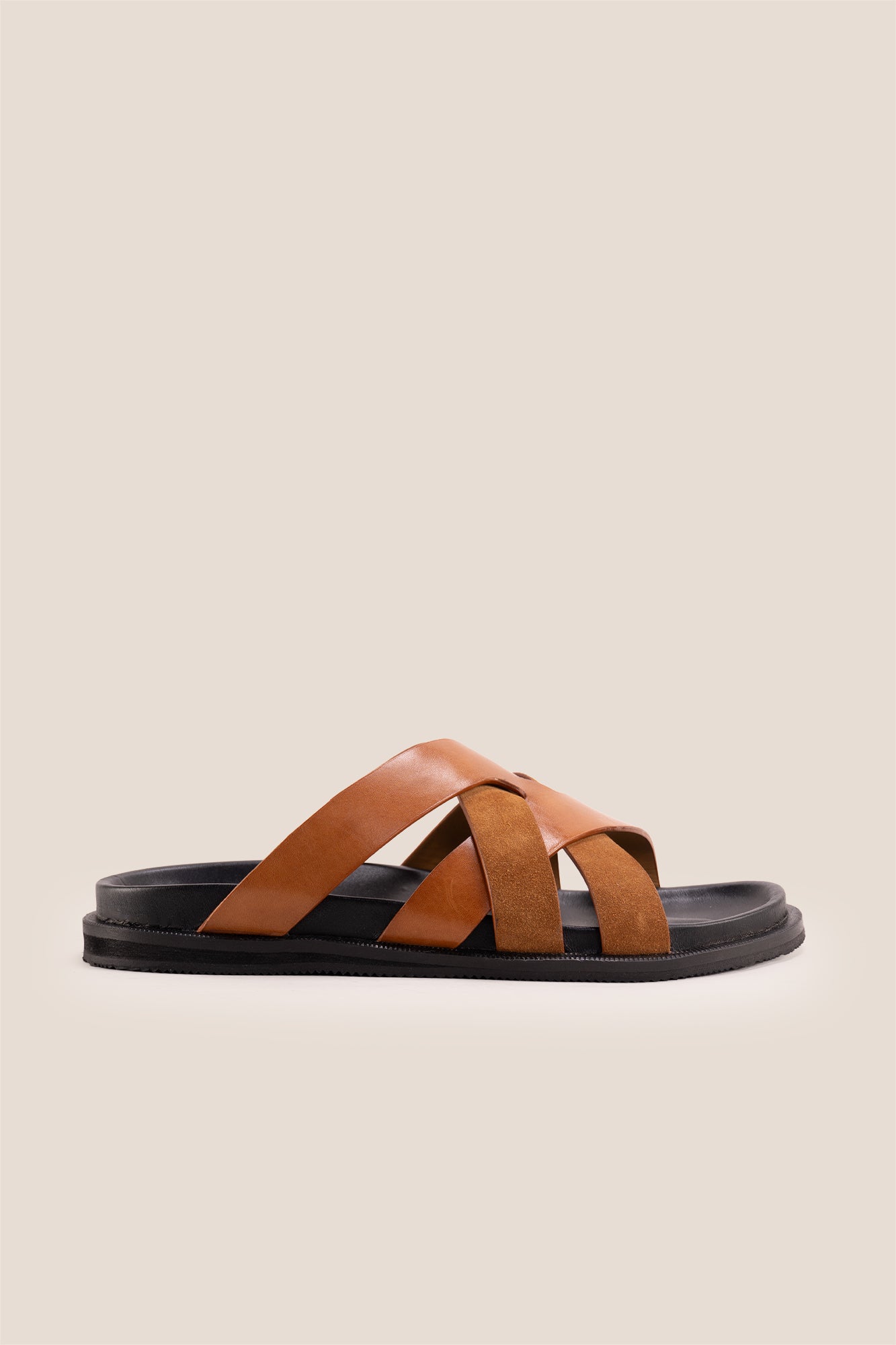 Men’s Rowan Tan slide sandals featuring a soft suede leather X-strap design and an earthy tan finish.