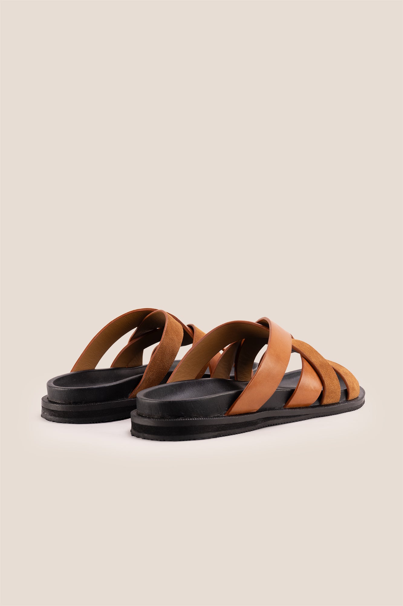 Men’s Rowan Tan slide sandals featuring a soft suede leather X-strap design and an earthy tan finish.
