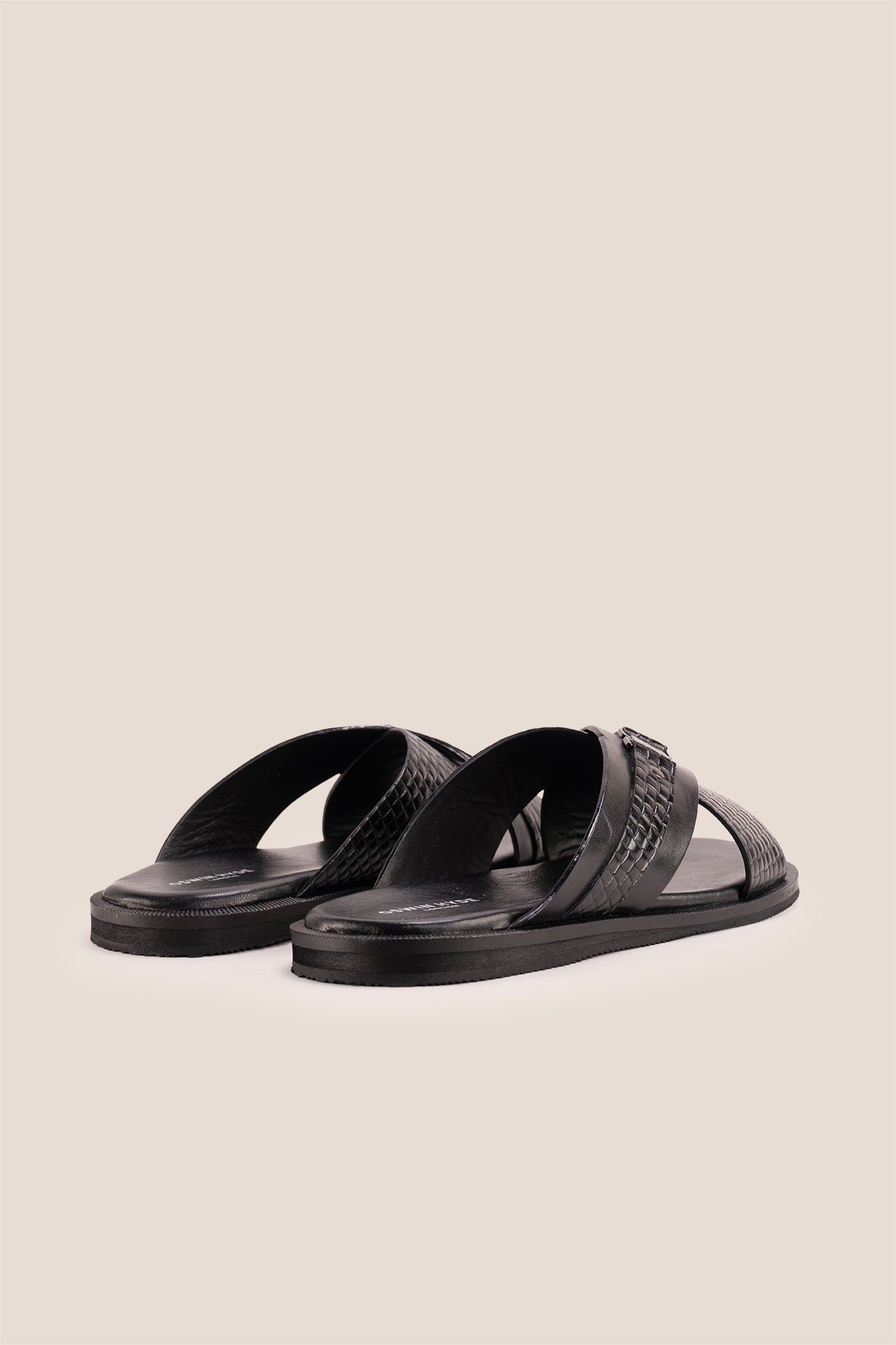 Aiden Black men’s leather sandals with a unique woven criss-cross strap design.