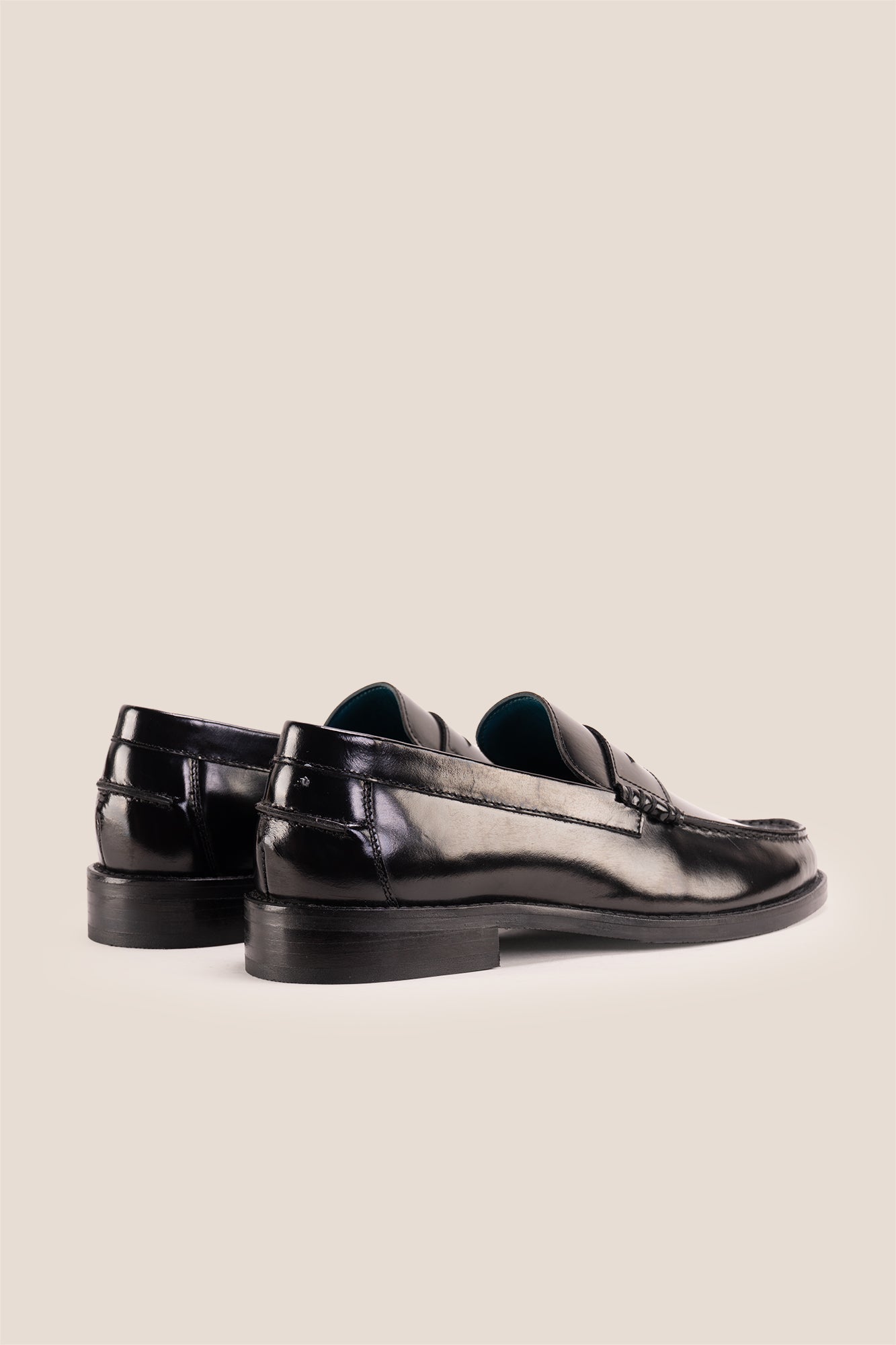 Oswin Hyde Peter Black leather penny loafers for men, crafted to deliver a classic and refined style. Constructed from premium leather